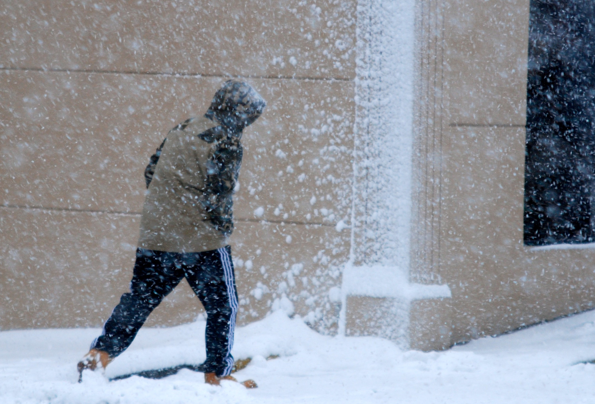 The snow made walking difficult. Above, a man outside the Starbucks at Camp and Merrick avenues in North Merrick.