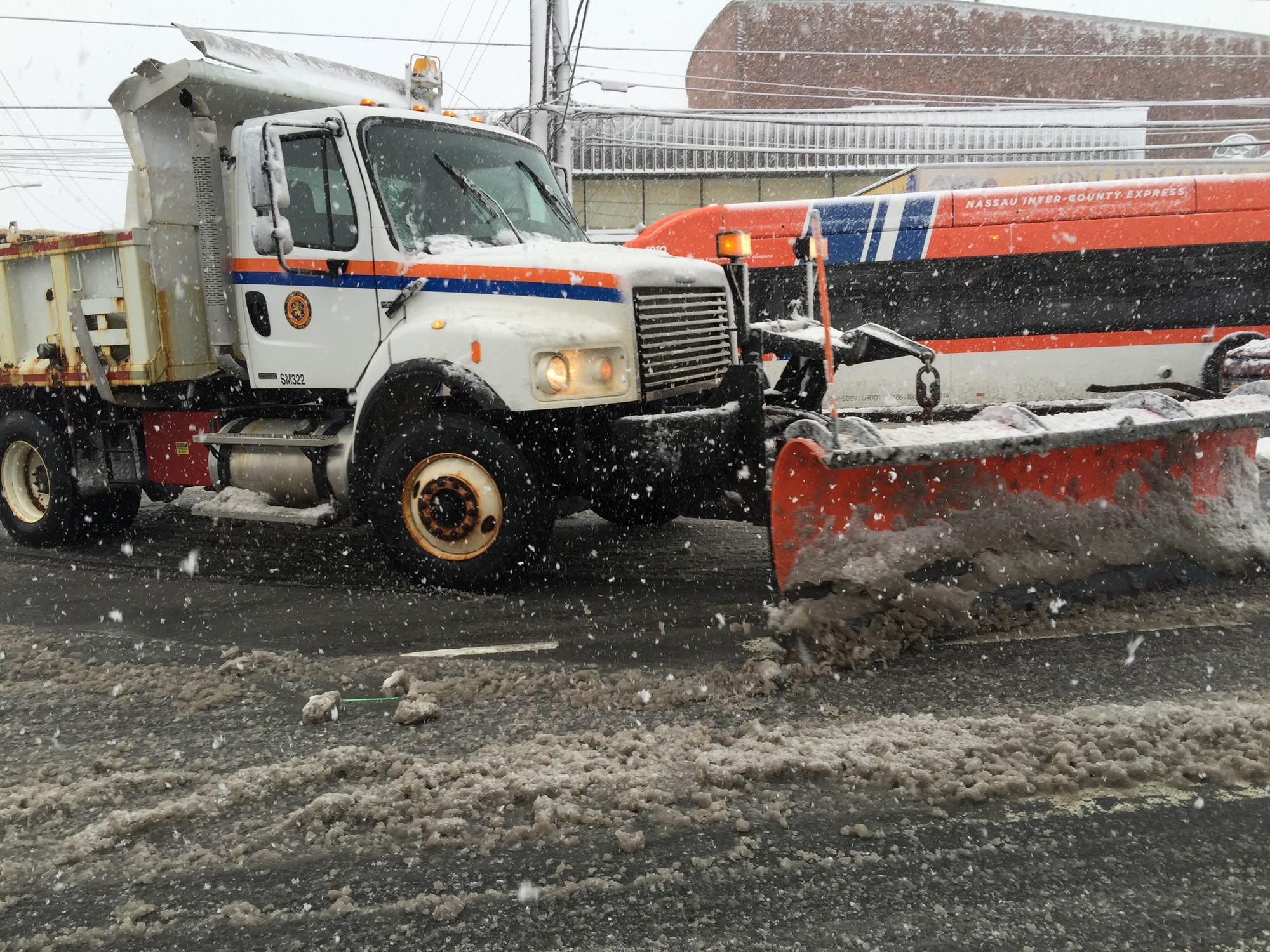 Nassauy County trucks are plowing snow throughout the area.