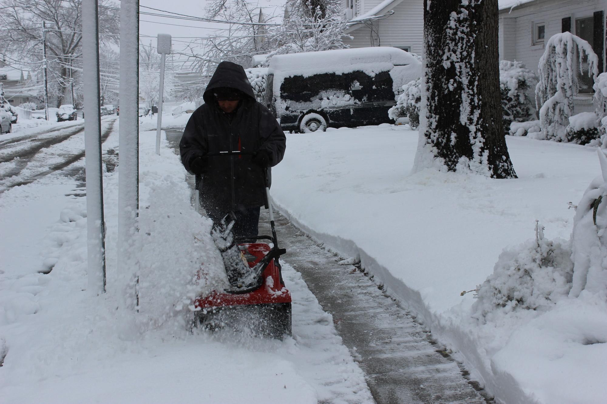 Nettaly Onque was hard at work with his snowblower on East Fairview Avenue.