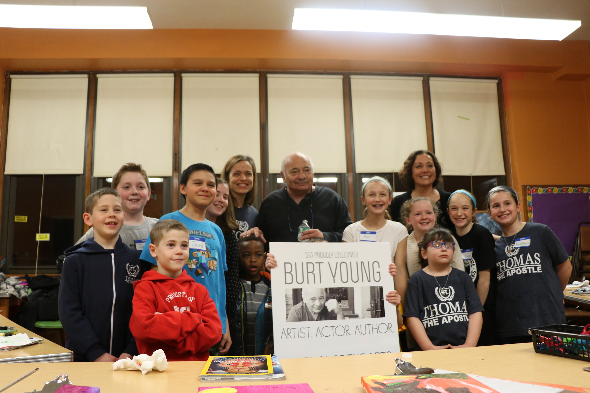 Young, Picone, and St. Thomas Principal Valerie Gigante, right, back row, with the students after their paintings were finished.