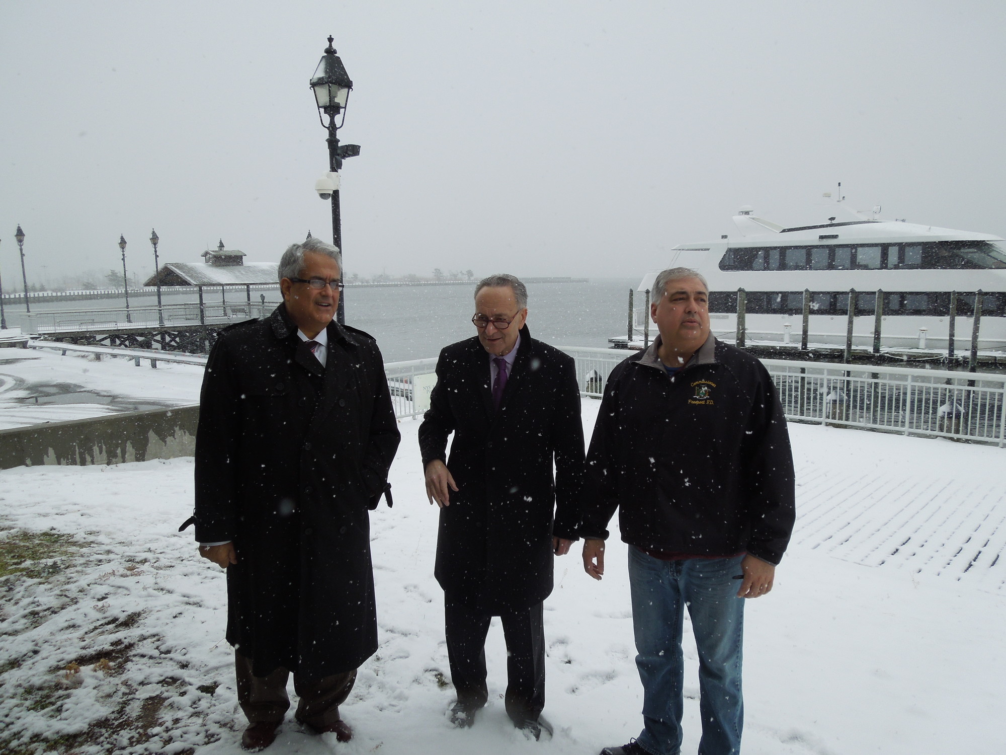 U.S. Sen. Charles Schumer, center, was in Freeport on Monday to urge the Army Corp of Engineers to fund a study to control flooding on the South Shore. With him were Hempstead Town Supervisor Anthony Santino, left, and Freeport Deputy Mayor Jorge Martinez.