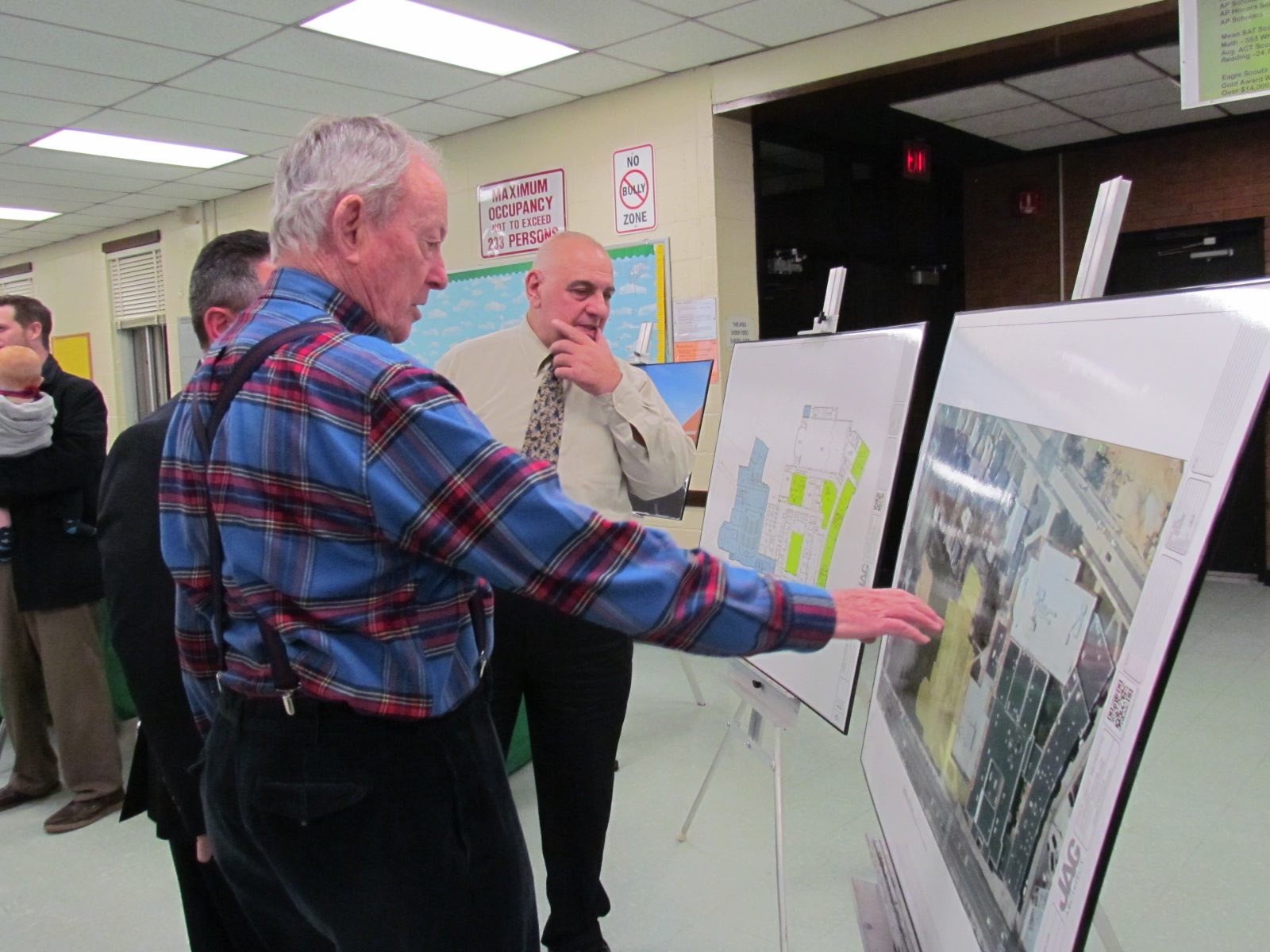 Bob Sympson observed the renovation plans provided by the project’s architectural firm.