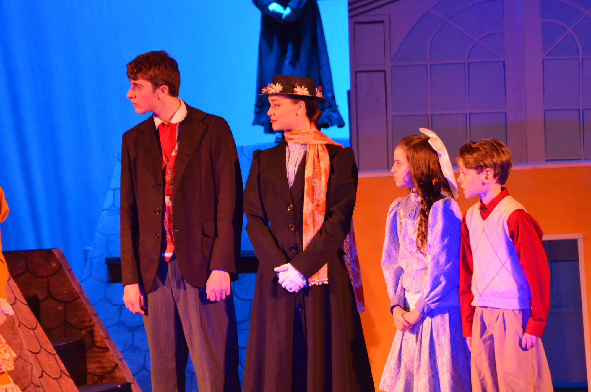 Bert played by Jack Neary, Mary Poppins played by Katharine Calabrese with Jane Banks played by Grace McNally and Michael Banks played by Brennan Donovan.