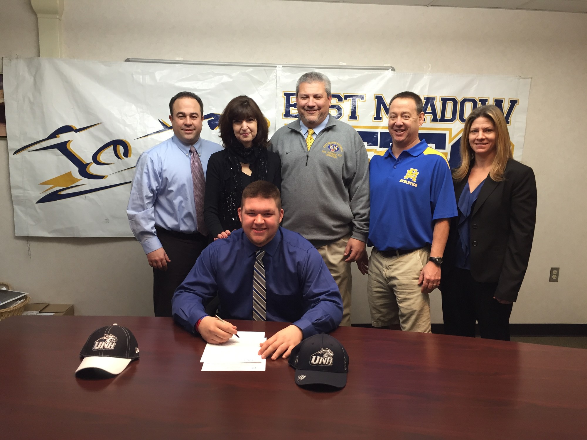 Matt Mascia, 17, signed a letter of intent to play football at the University of New Hampshire last week, with his parents and East Meadow School District officials on hand.