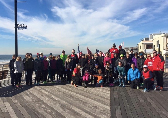 Members of Team Red, White and Blue lead a “Hot Chocolate Run” on the boardwalk Jan. 30 for Long Beach runners and walkers.