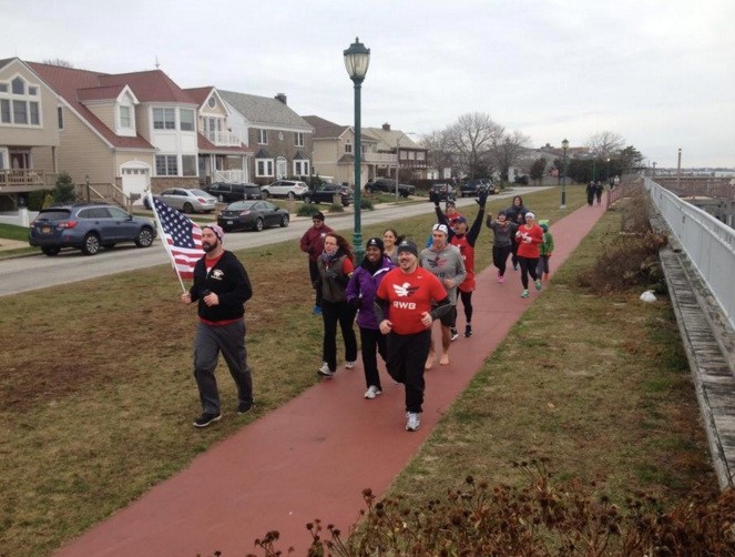 Members of Team Red, White and Blue run along the bay to Veterans Park on Jan. 17 to raise funds for a local wellness center for combat veterans, Peaceful Minds.