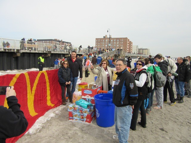 Beachgoers waited in line to receive free hot chocolate, an alternative to alcohol, during the family event.