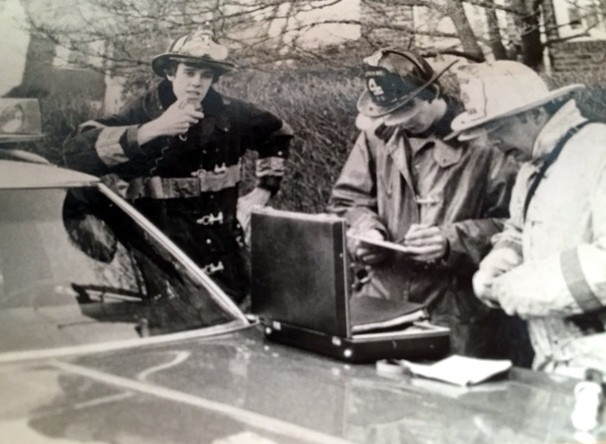 A young David Walsh with firefighters Brian Martin, center, and David Weinstein near right, operating at a Malverne Fire Command post in an undated photo.