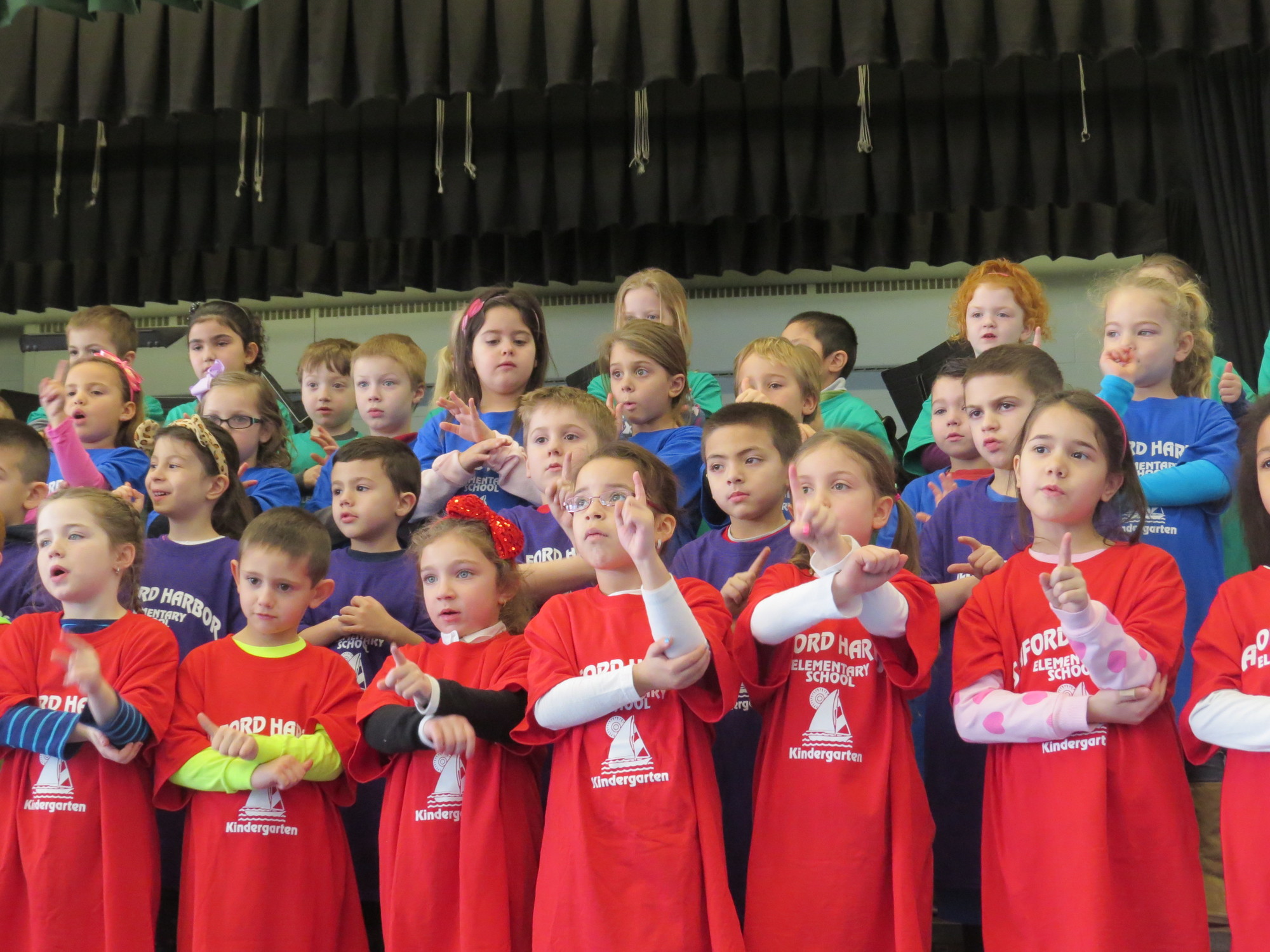 Seaford Harbor kindergartners used sign language and their voices to perform songs about the number 100.