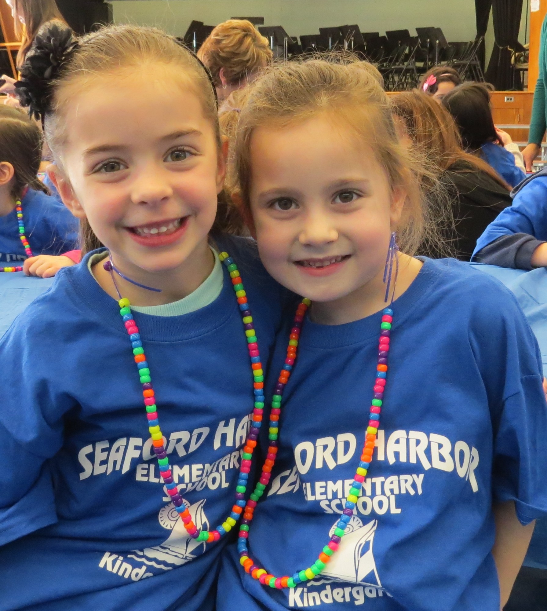 Students from Carol Rindos’s class at Harbor displayed their finished necklaces made of 100 beads.