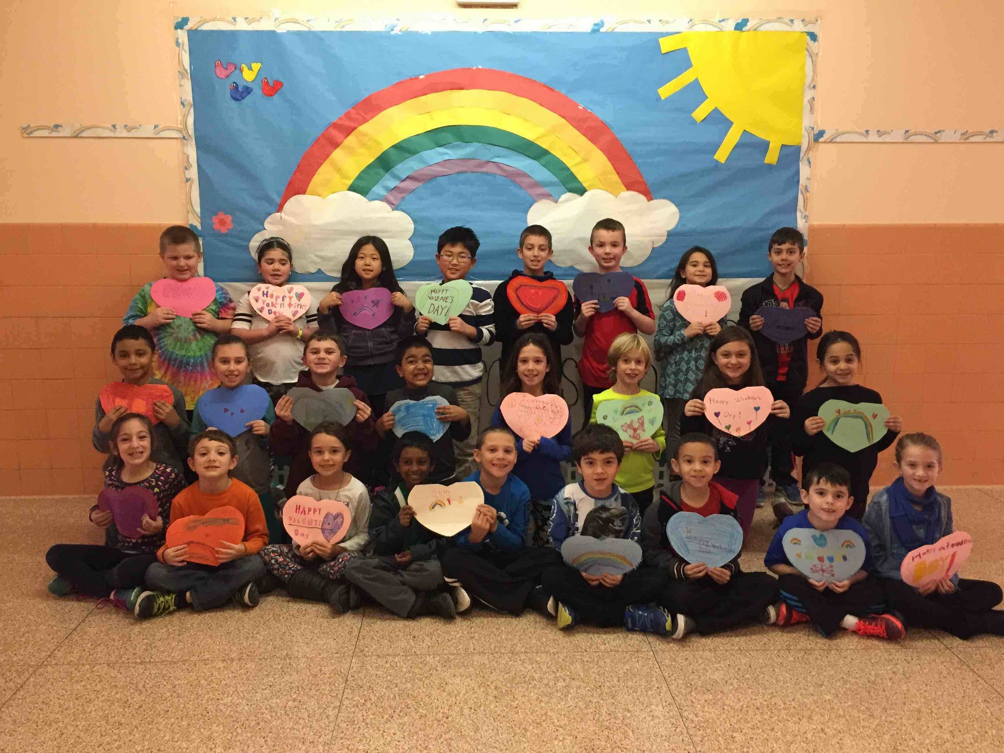 Second-graders were happy to craft heart-shaped works of art for their heroes, East Meadow School District officials said.