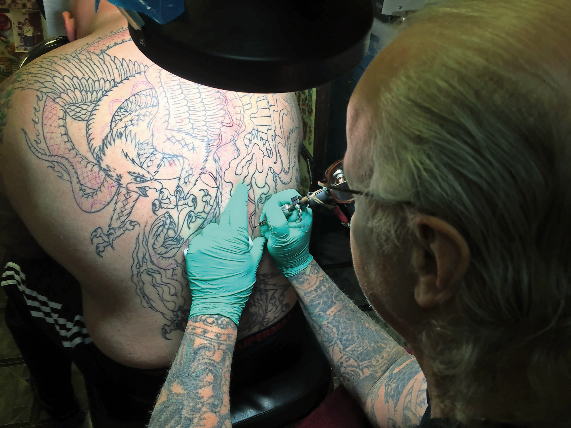 Eric Voye, of East Meadow, sat in a chair for two hours while Richie Montgomery, owner of Tattoo on Hempstead Turnpike in Elmont, crafted his tattoo.