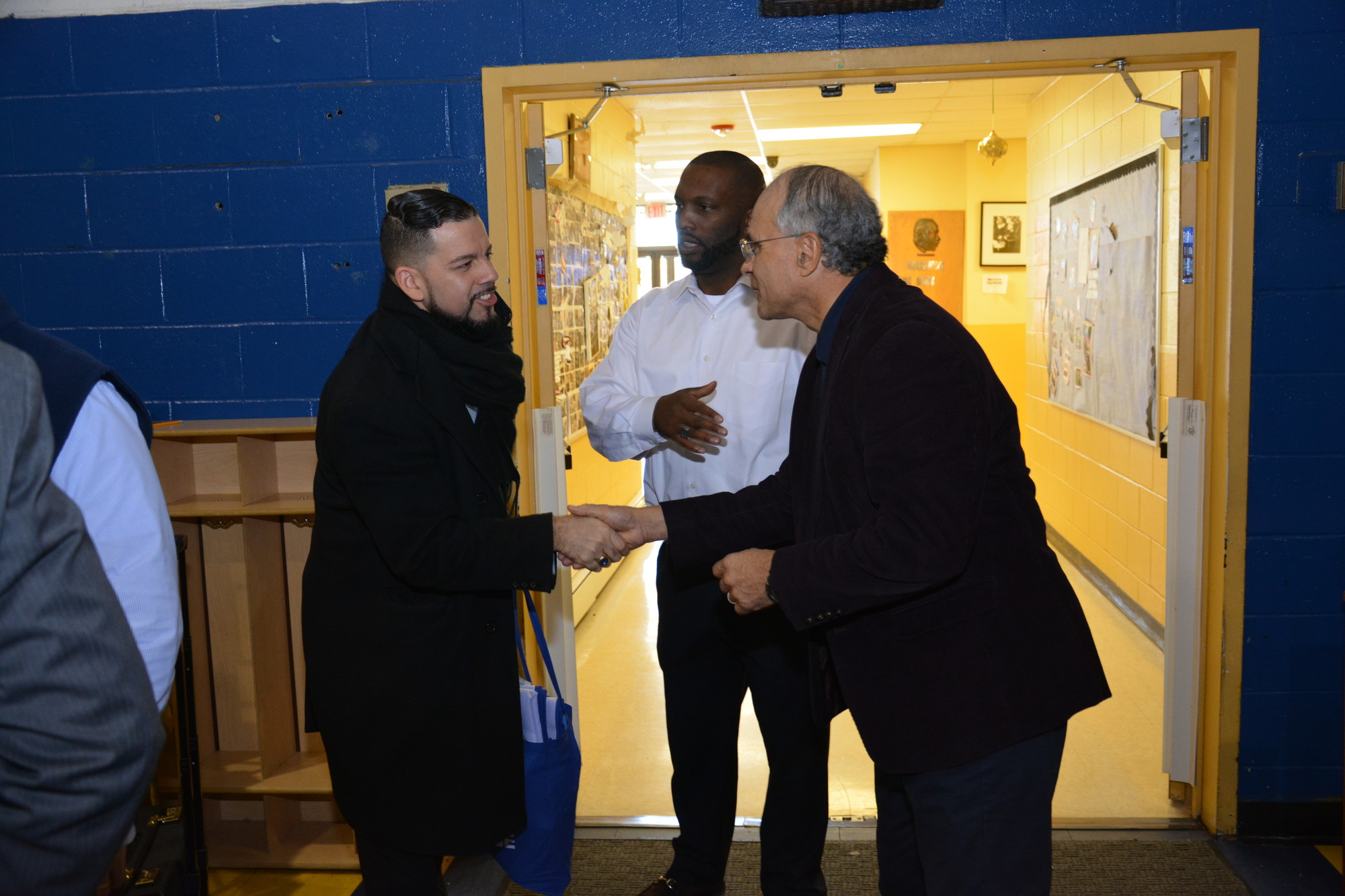 City Council President Len Torres, right, and Martin Luther King Center Board Chair James Hodge, center, greeted attendees at the facility’s first college fair on Feb. 18.