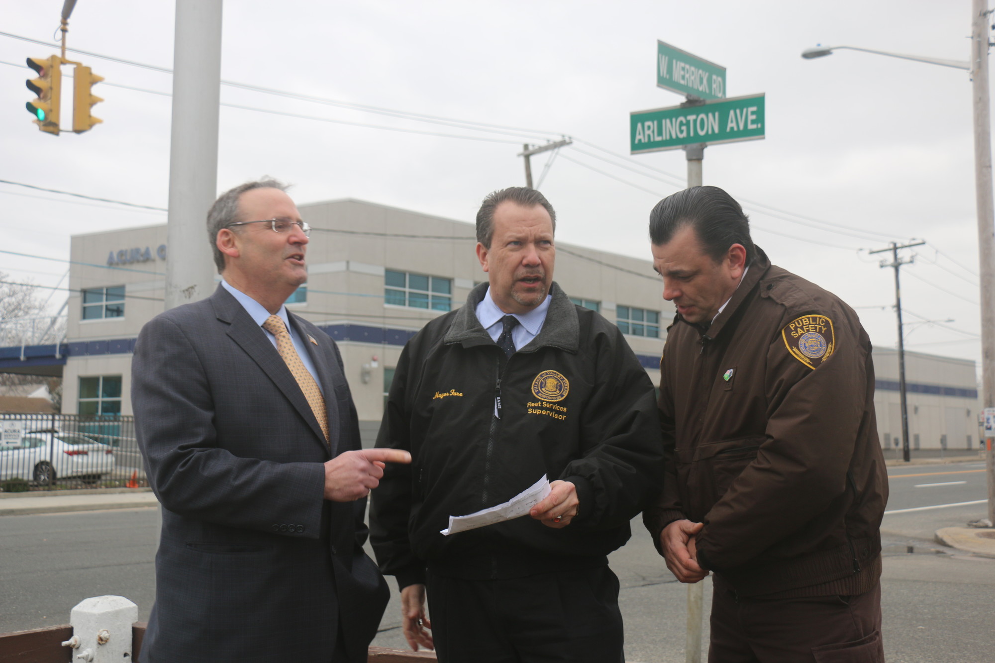 Legislator Bill Gaylor, left, Mayor Ed Fare and Valley Stream Public Safety Supervisor Vincent Cusumano gathered at the intersection of West Merrick Road and Liberty Boulevard to discuss the village’s request for a county-funded safety survey of the roadway.