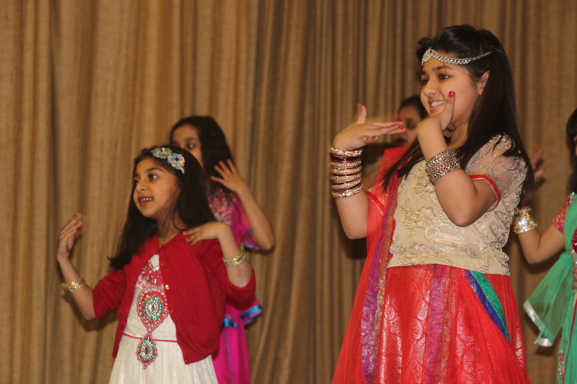 Yumna Junaid, left, and Jannet Ashraf never lost their smiles as they danced.