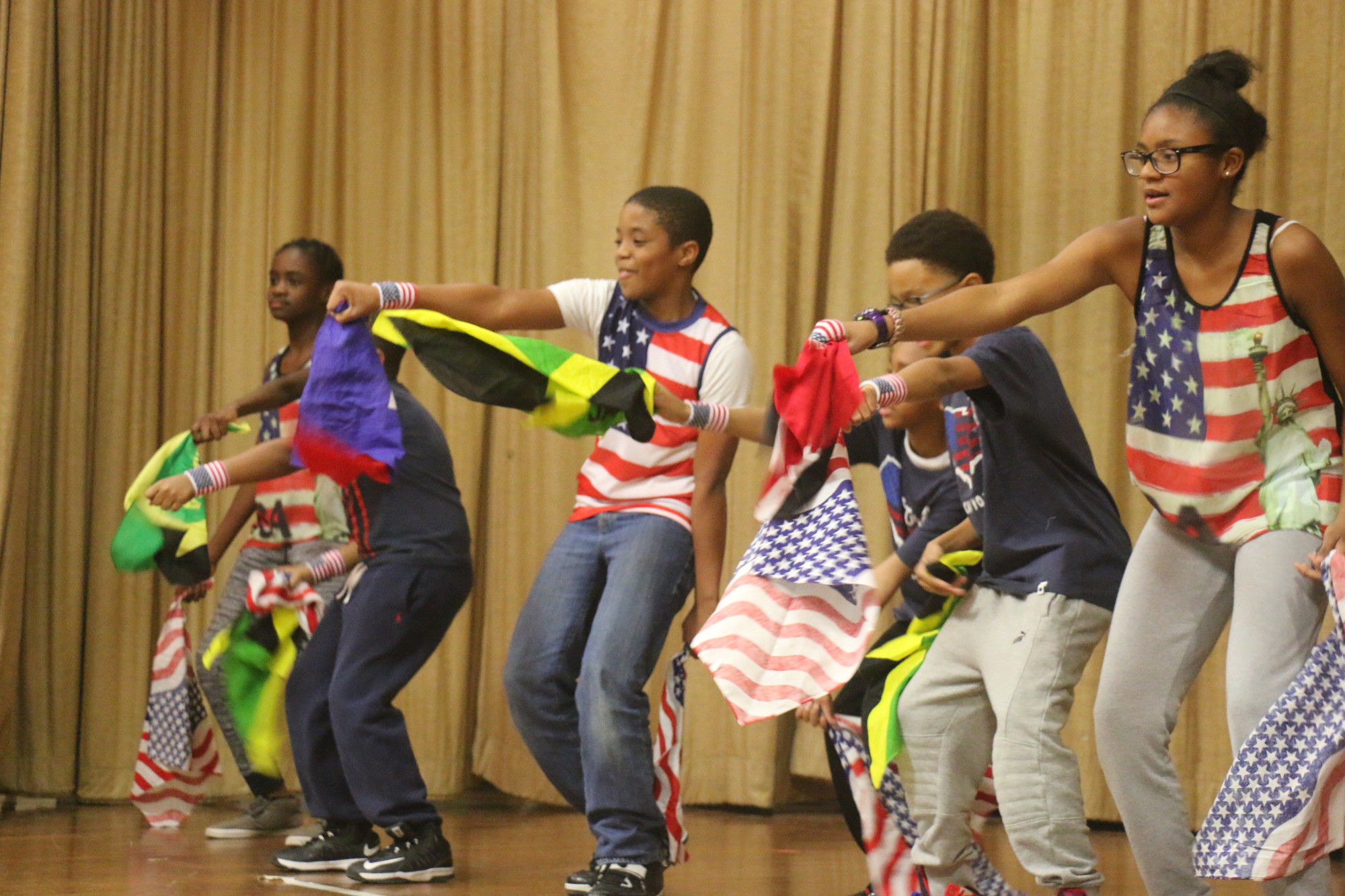 Students danced to “Watch Me (Whip/Nae Nae)” with American, Haitian and Jamaican flags.