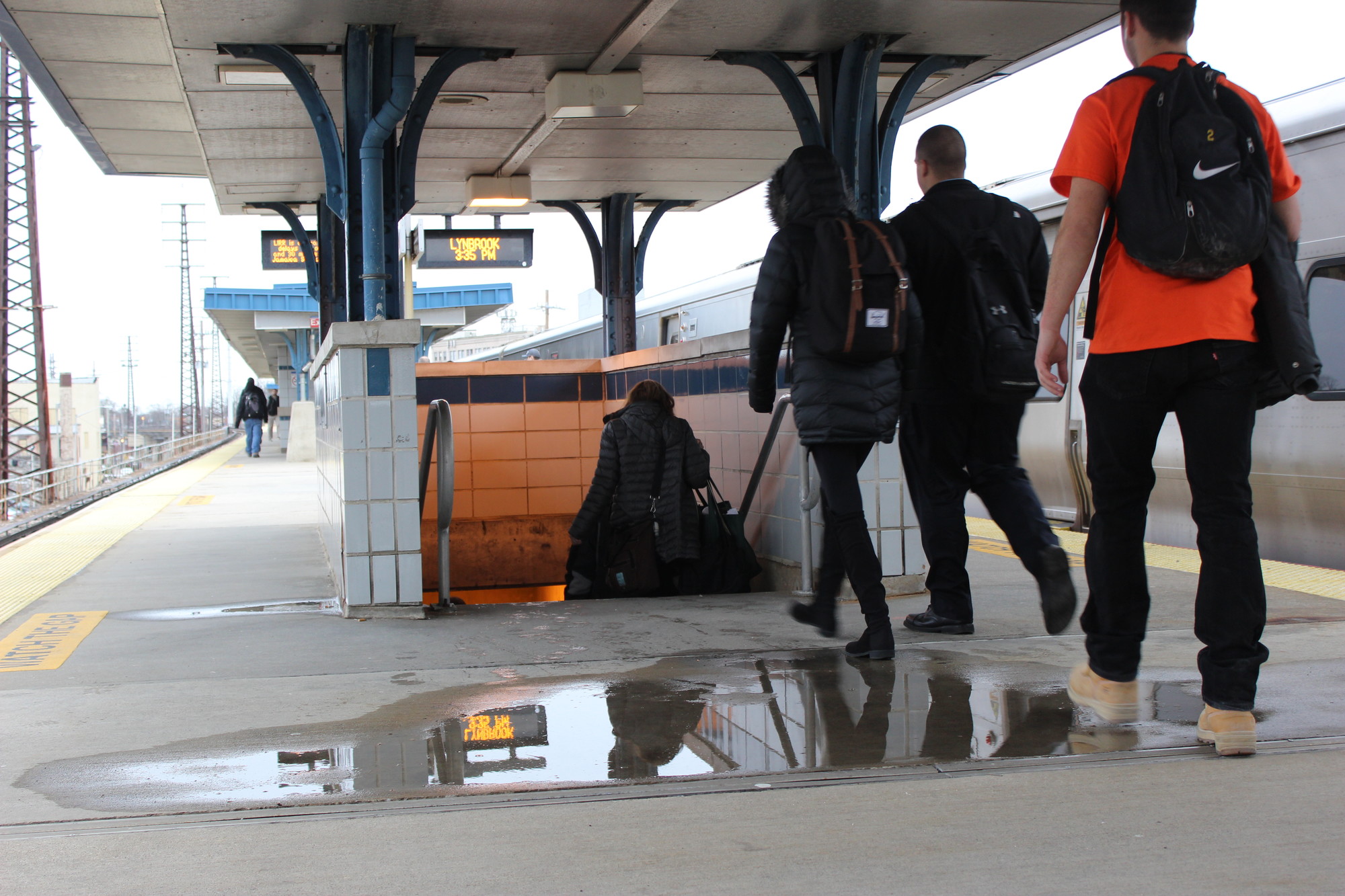 Pools of rainwater collected underneath a leaky roof canopy at the Lynbrook train station after a heavy rainstorm.