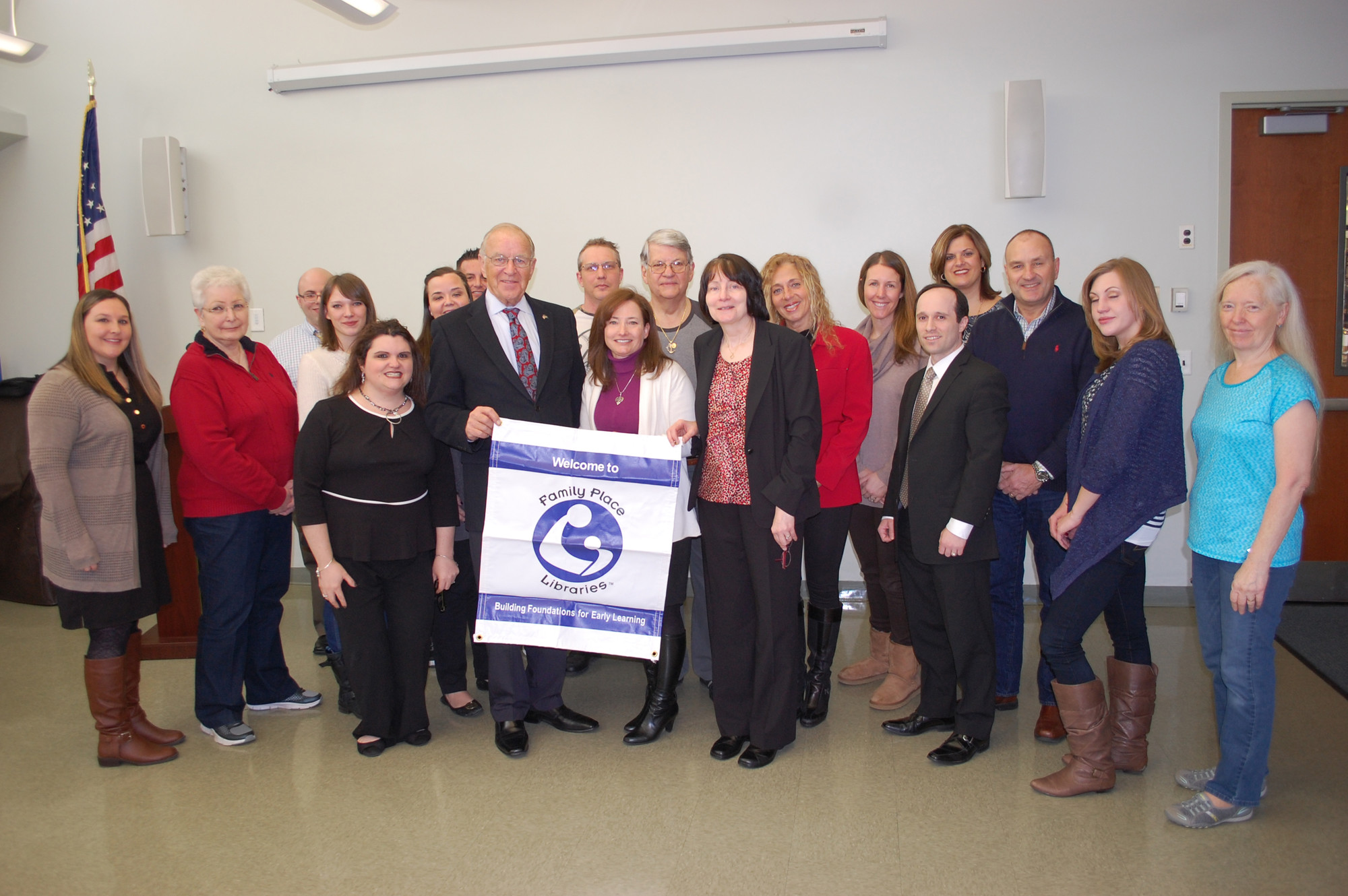 Family Place Libraries representatives presented the Wantagh Public Library with a banner proclaiming the designation.
