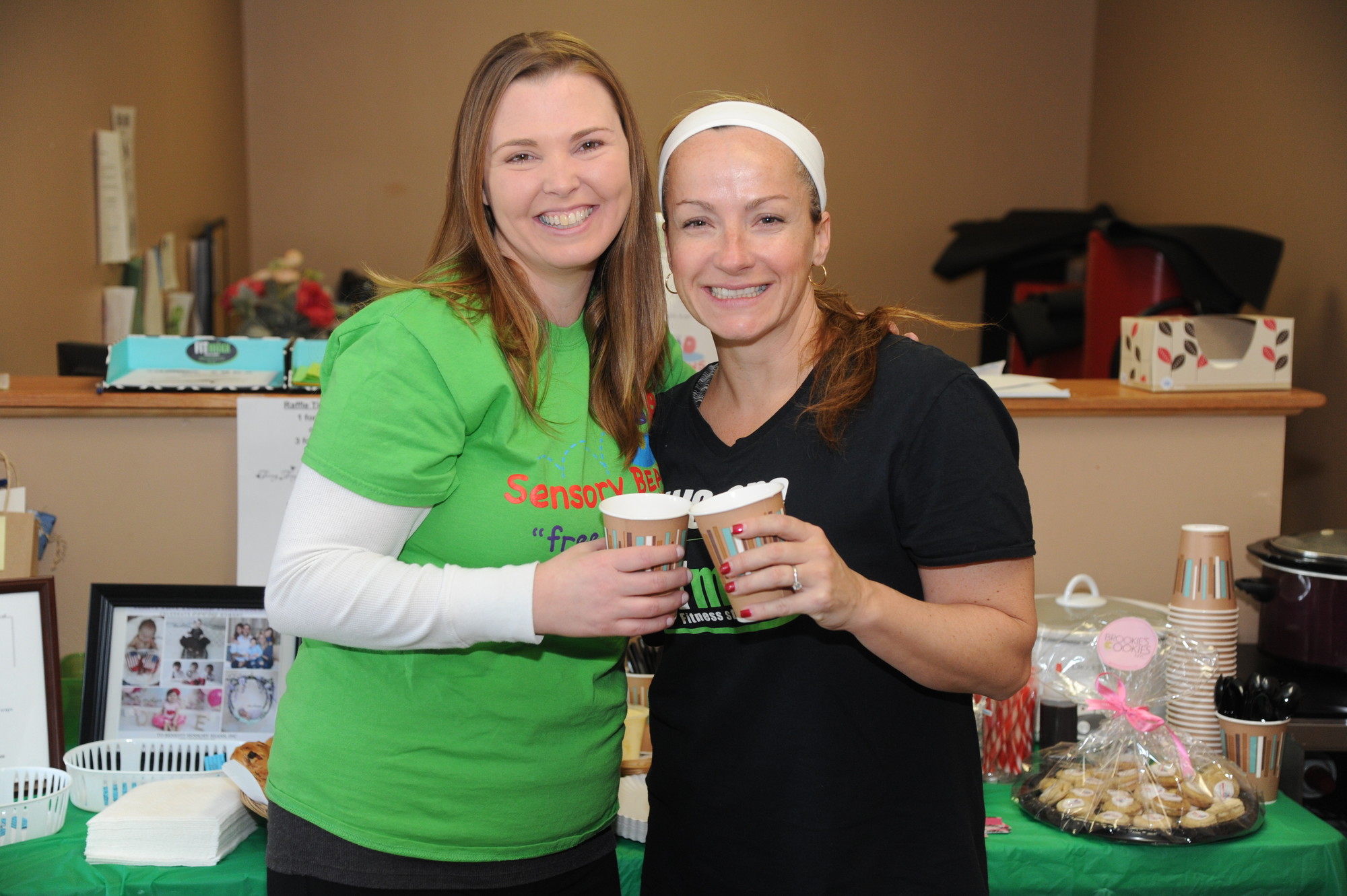 Rachel Roslow, left, co-founder of Sensory Beans, and FITmixx owner Shannon Palagiano enjoyed a cup of hot chocolate at the nonprofit organization’s Feb. 28 fundraiser.