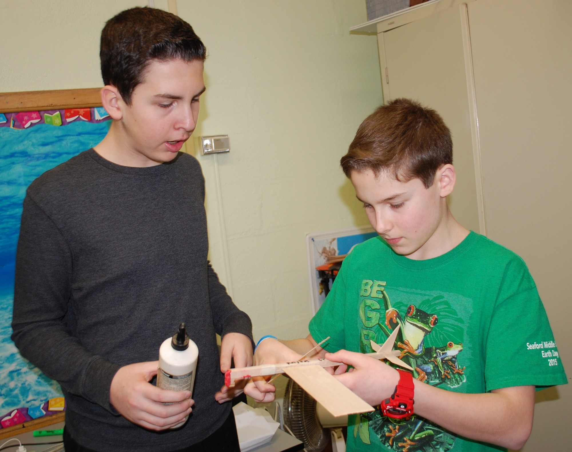 Seaford Middle School students Joe Abbate, left, and Ryan Demino put the finishing touches on their rubberband-powered airplane.