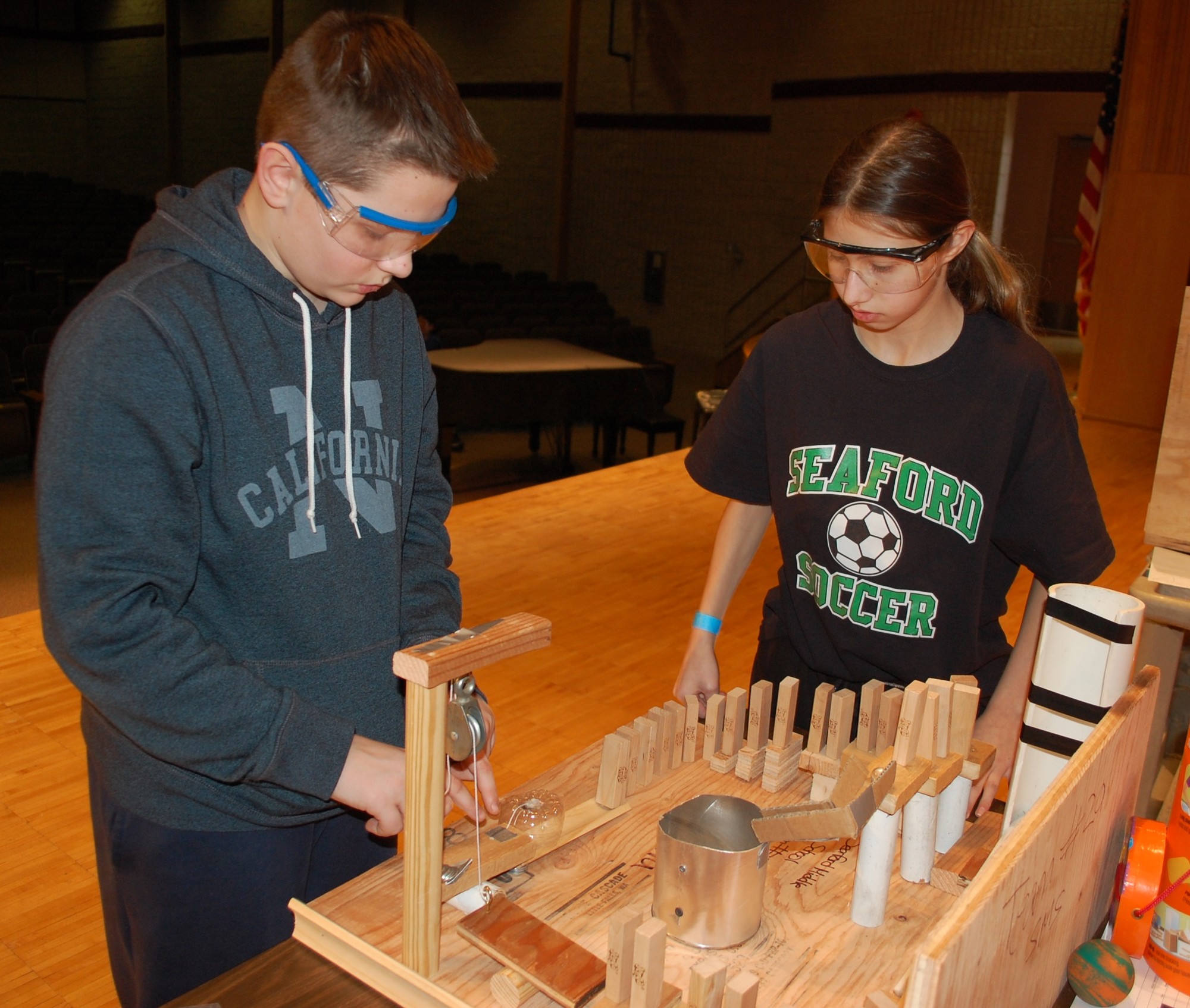 Kevin Weir and Kristina Karakasians, of Seaford, tested their Rube Goldberg machine. The multiple-step process had to end with a bell ringing.
