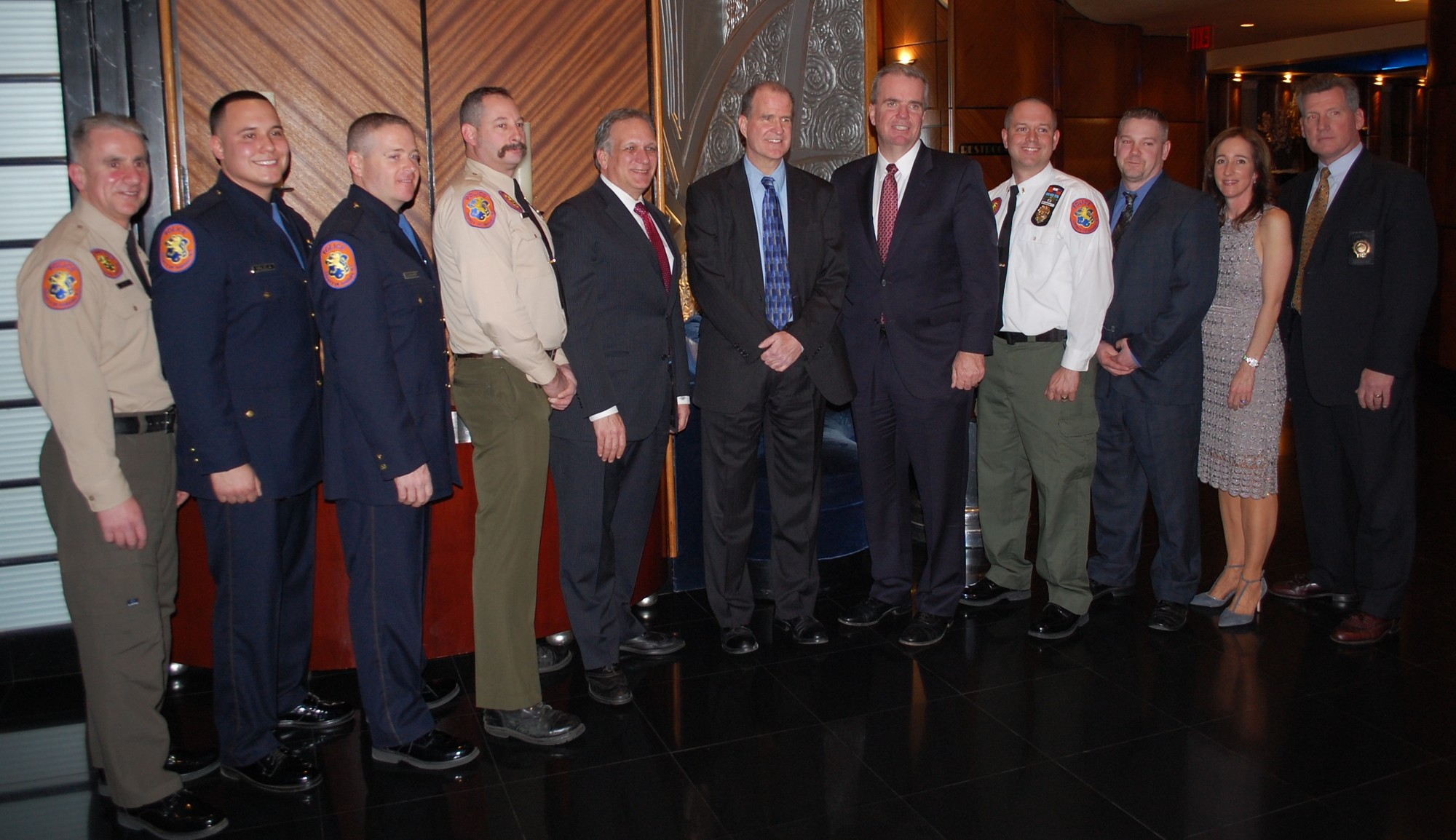 The officers, medics and citizens who saved Terry Twibell, center, were honored by Nassau County Executive Ed Mangano and Acting Police Commissioner Thomas Krumpter on March 9 at Chateau Briand in Carle Place.