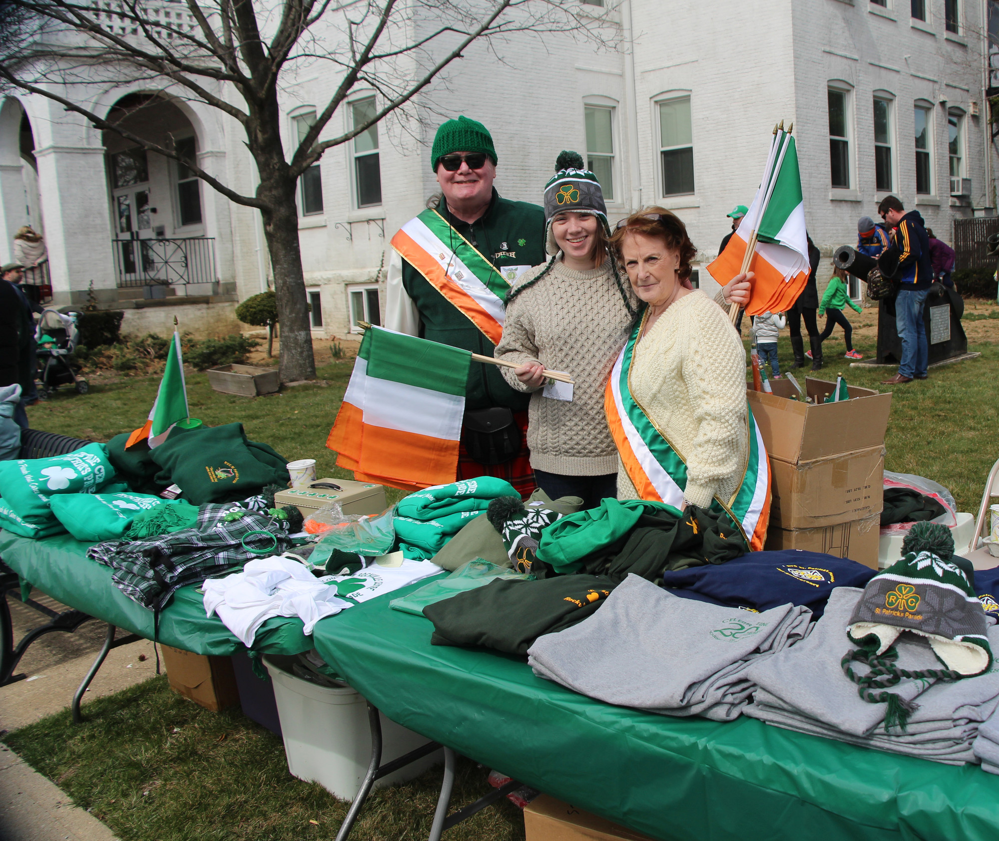 Kevin O’Brien, his daughter, Carolynn, and Kathi Collins sold official parade merchandise. The sales helped support the parade’s three chosen charities.