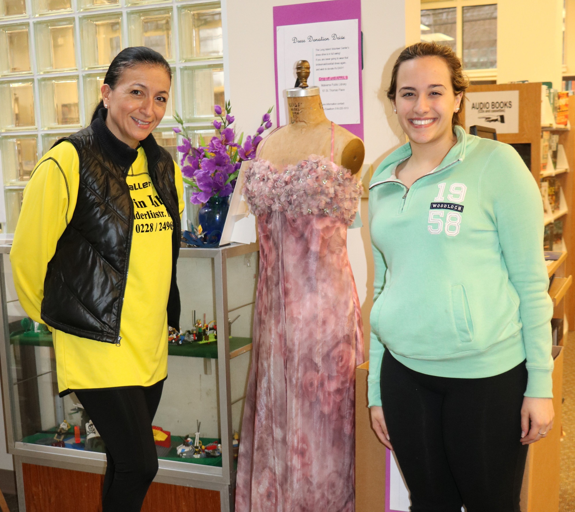 Malvernites Maria Hafker, left, and Victoria Marmo discovered the prom dress drop off site during their trip to the library last week.