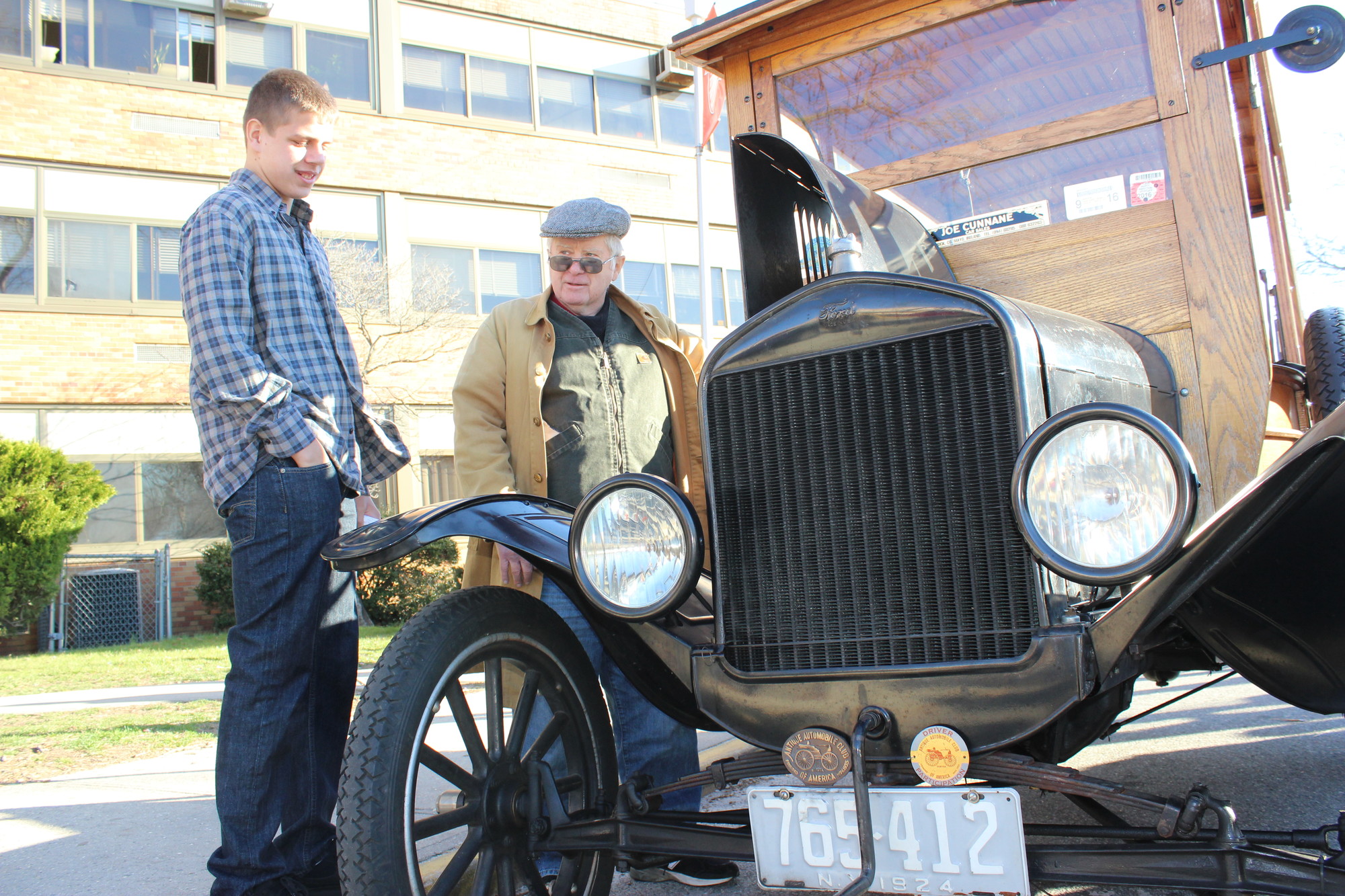 John Cunnane, right, taught Dylan Vanetten about the inner workings of his 1924 Model T Ford.