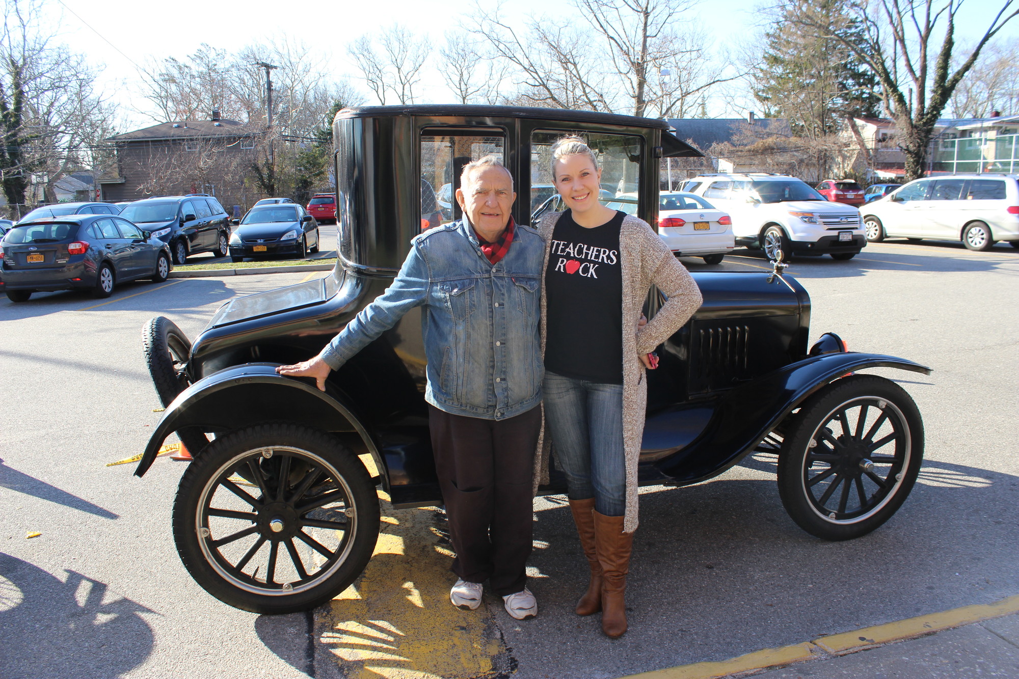 English teacher Ginger Calderaro, right, and her father, Robert Gunther, in front of his 1930 Model A Ford.