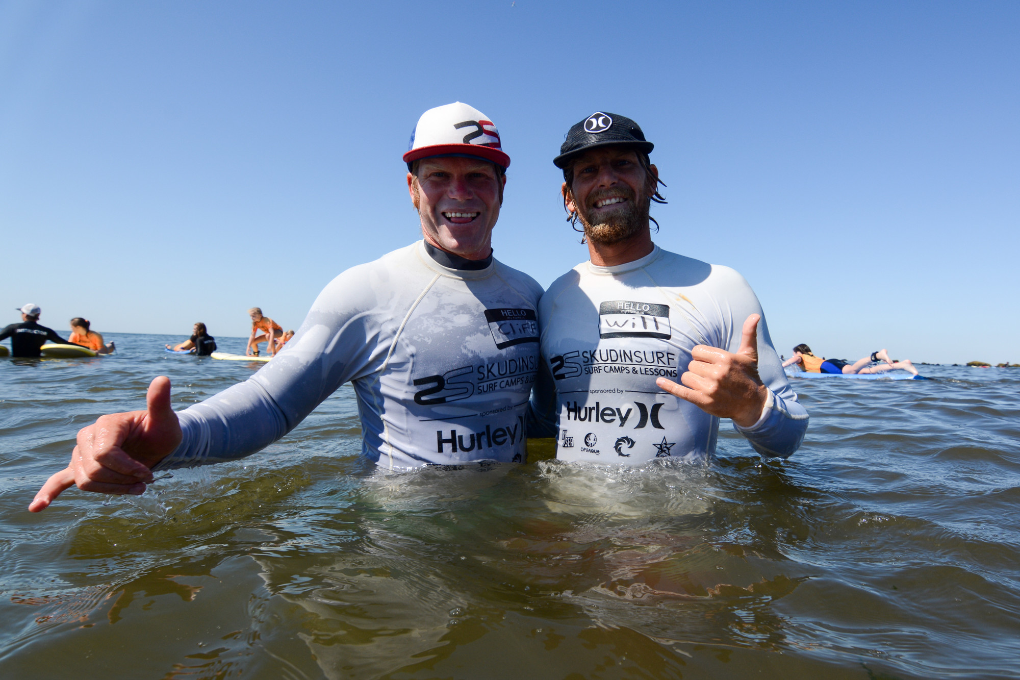 Pro surfers Cliff Skudin, left, and his brother, Will, run the Skudin Surf school in Long Beach.
