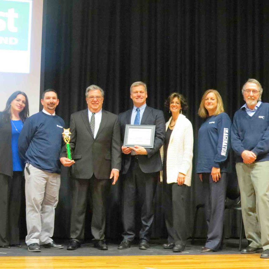 Woodland Middle School and East Meadow School District officials accepted the first place honor for the Students Feeding Students Challenge from Island Harvest President and CEO Randi Shubin Dresner, third from right, on March 3.