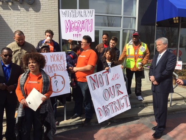Mimi Pierre Johnson, a community organizer for New York Communities for Change and resident of Elmont, accused Chris McGrath, right, and his campaign of disseminating “racist, fear-mongering literature.”