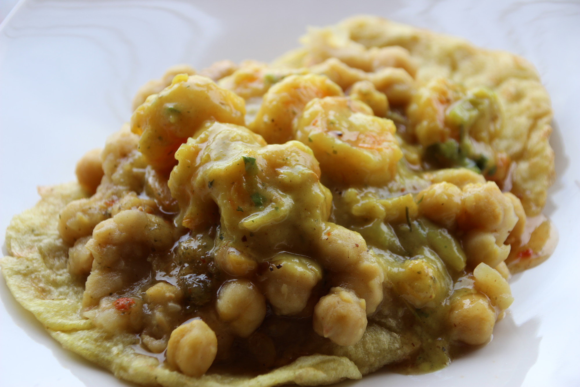 Shrimp doubles, topped with chickpeas and wrapped in a pita, are Ms. B’s take on a classic Trinidadian street food.