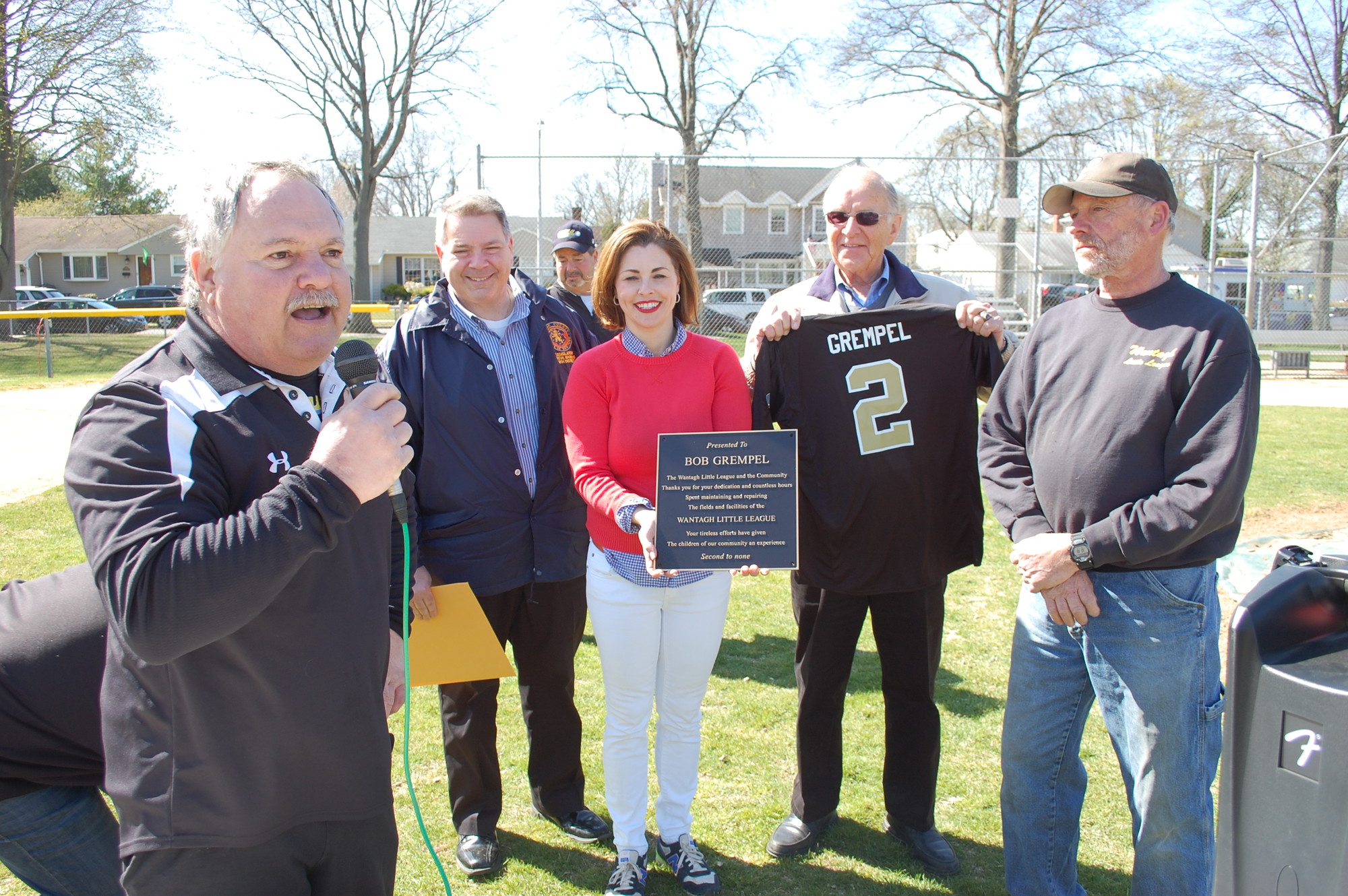 Ed Ciminielli, left, spoke about Bob Grempel, at right, who was honored for his work maintaining the Wantagh Little League’s fields. Also pictured are County Legislator Steve Rhoads, Town Councilwoman Erin King Sweeney and State Assemblyman Devid McDonough.