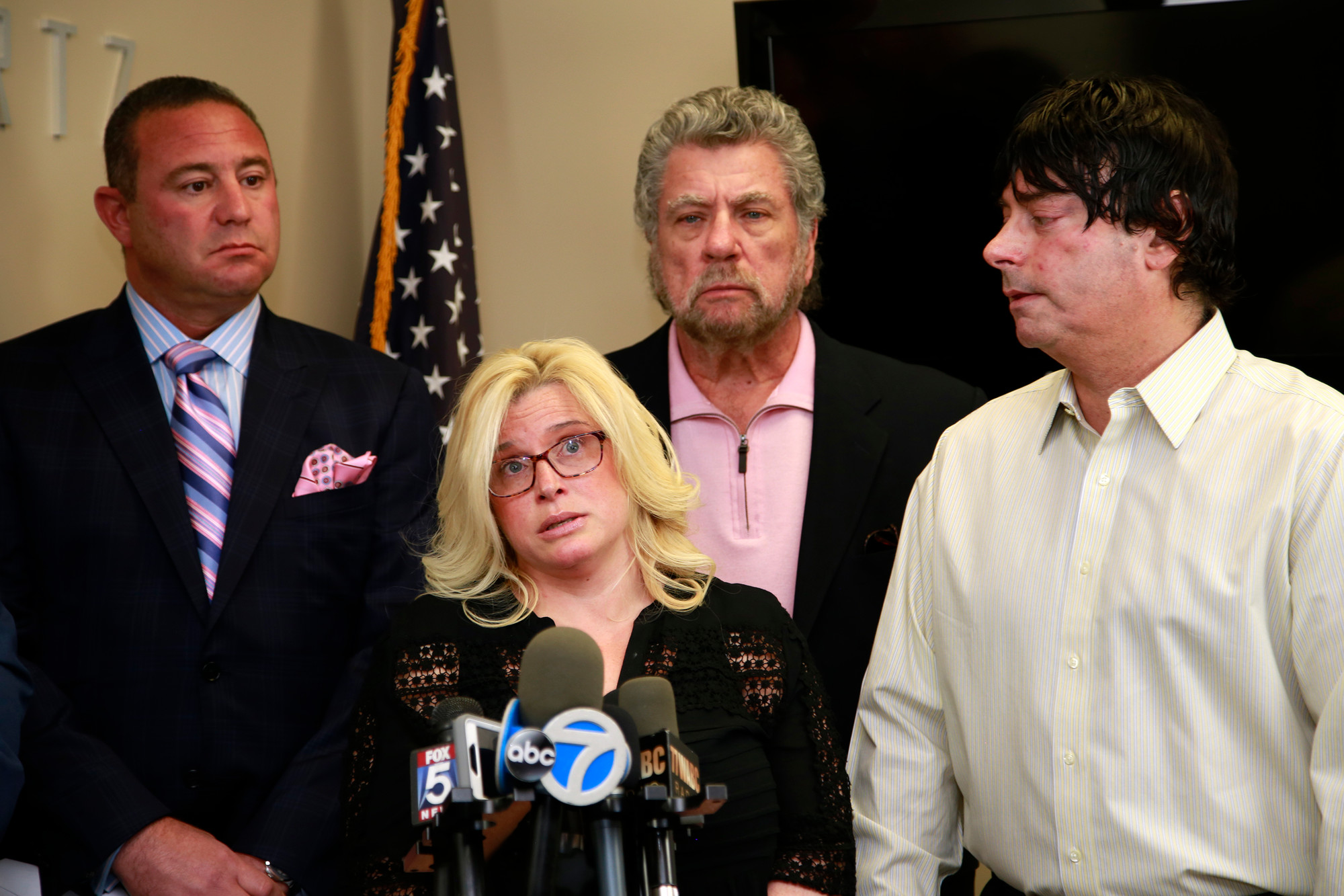 Kim Greengus, the alleged victim’s mother, front, addressed the media Thursday with attorney Brad Gerstman, left, private investigator Les Levine and her husband, Todd Greengus.