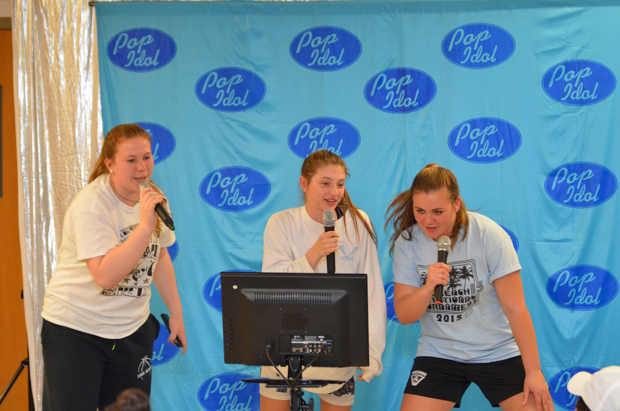 Sophomores Emily Rivera and Jen Rotando and junior Jess Marcote belted out the tunes during Pop Idol karaoke.