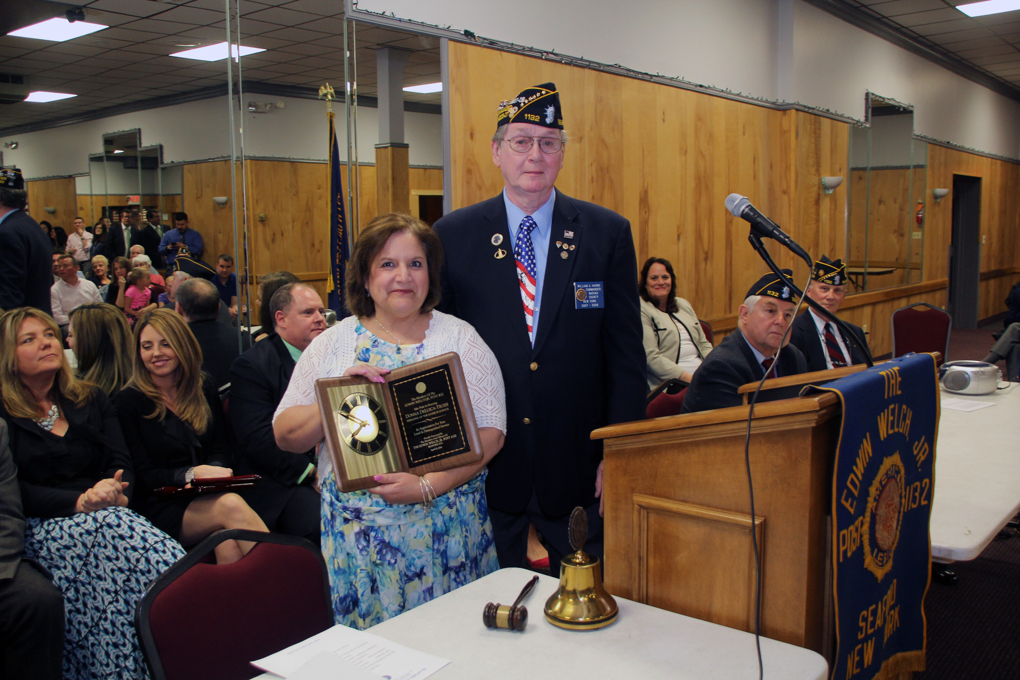 American Legion Commander William Harms presented an award to retiring Seaford Harbor School Principal Donna DeLucia-Troisi.