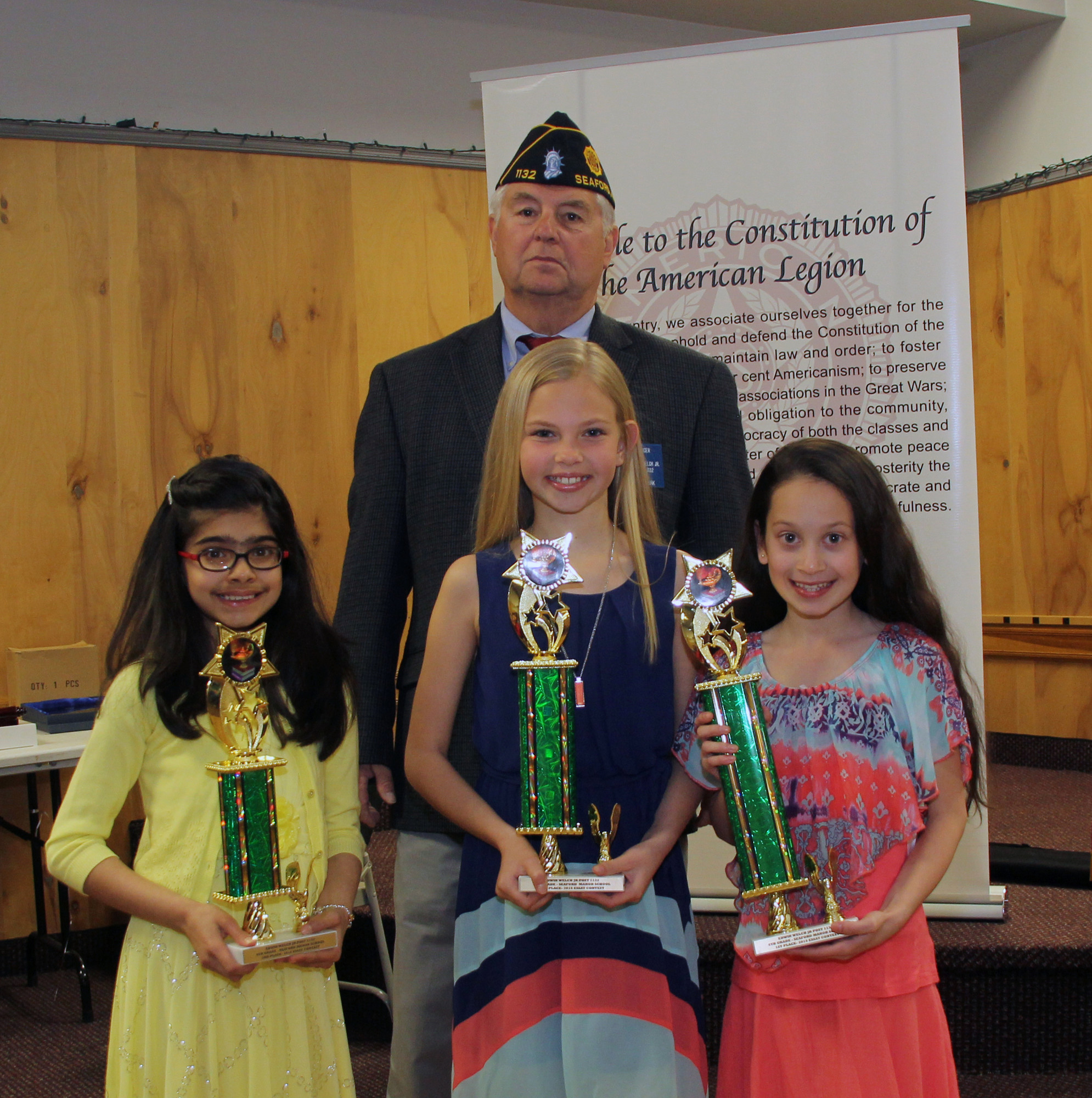 Legionnaire Bill Hoehn with the Seaford Manor School fourth-grade winners of the Seaford American Legion Essay Contest 1st Place Dylan Wong, 2nd Place Katherine Hoehn and 3rd Place Umika Hathiramani.