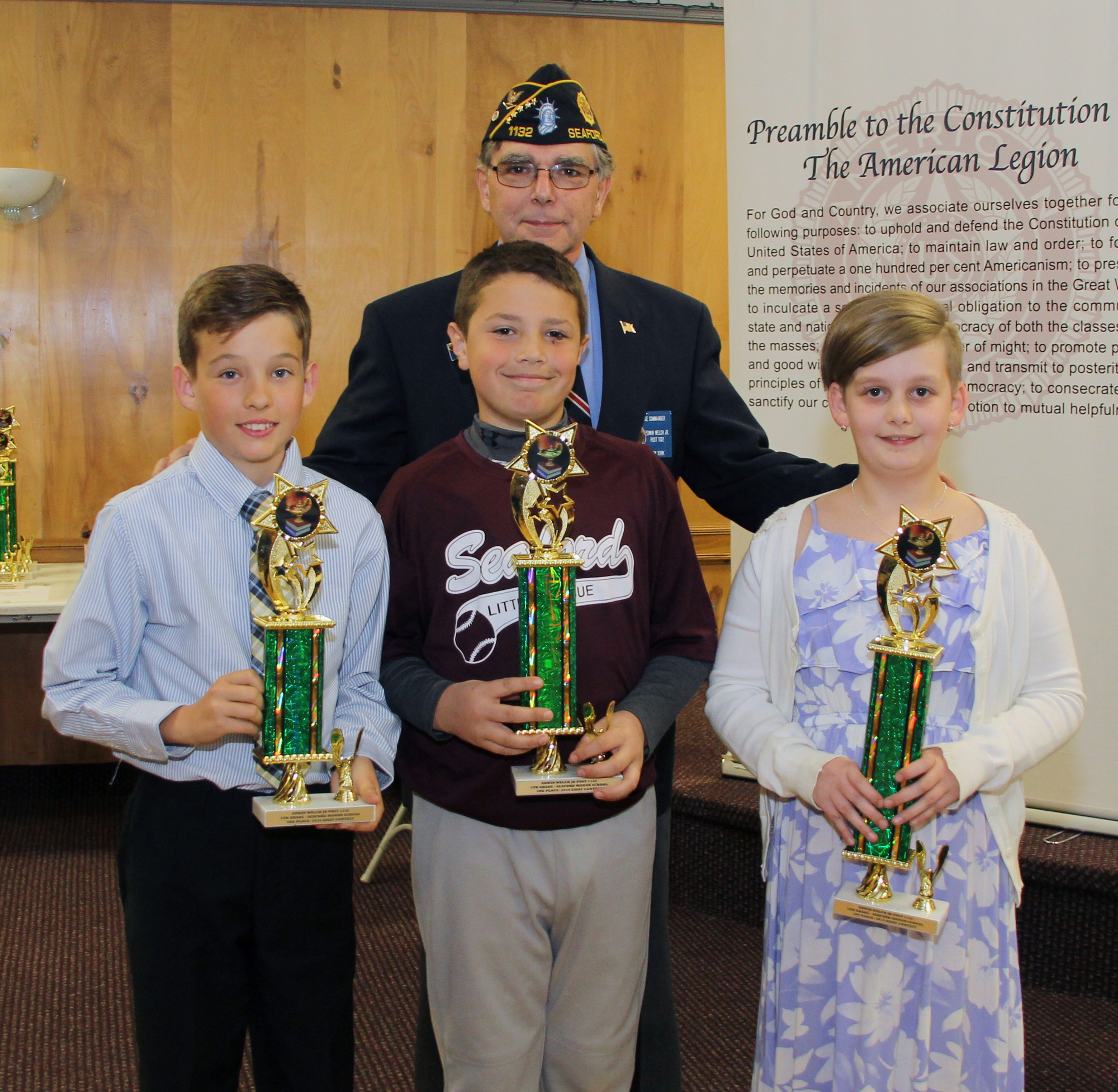 Legionnaire Charles Sammut with the Seaford Manor School-fifth-grade winners of the Seaford American Legion Essay Contest 3rd Place Connor Lochner, 2nd Place3 Andrew Geoghan and 1st Place Adrienne Plummer