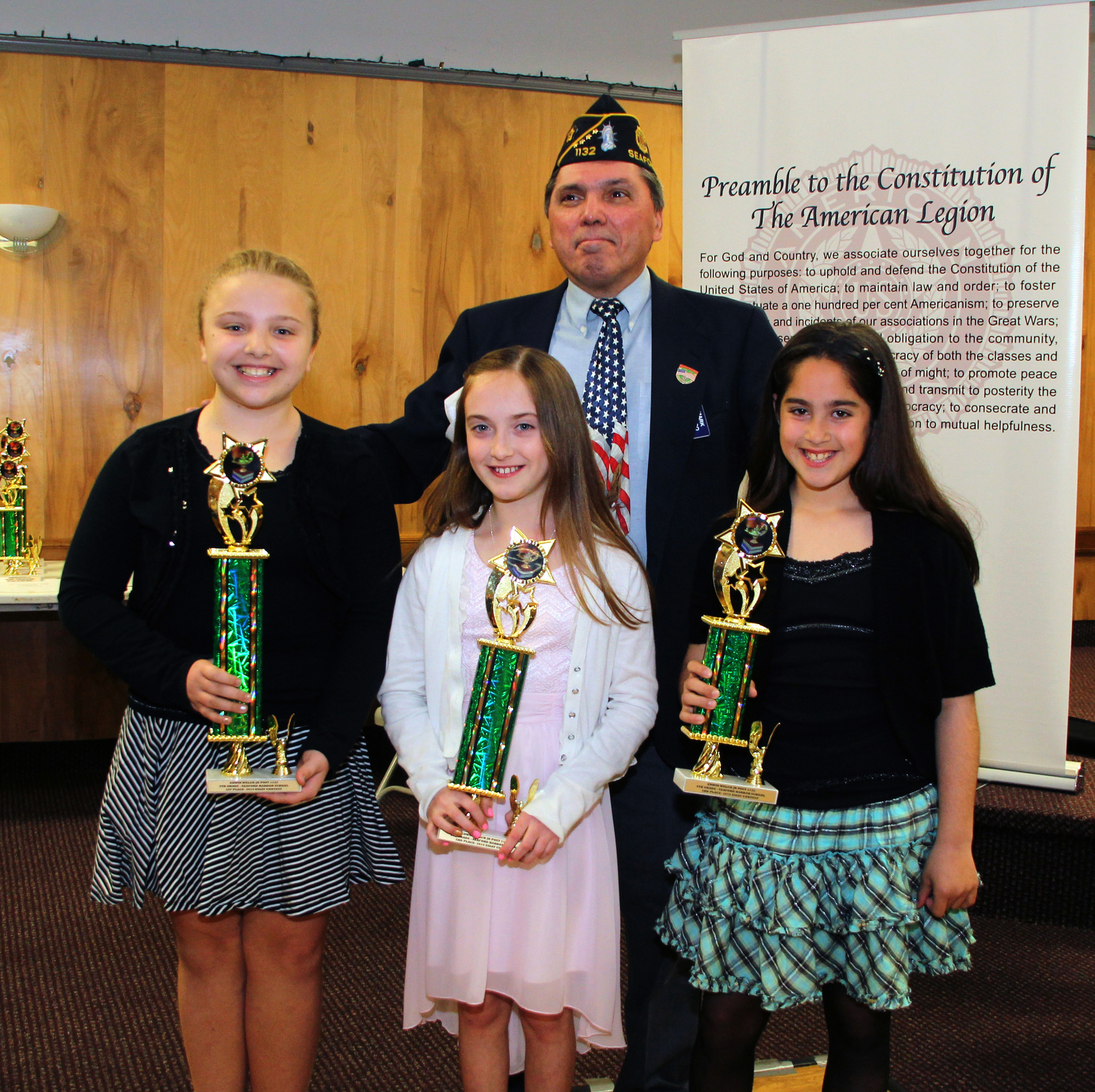 Legionnaire March Caleco with the Seaford Harbor School fourth-grade winners of the Seaford American Legion Essay Contest, 1st Place Mary Saporito, 2nd  Place Ashley Rauch and 3rd Place Arianna Garcia
