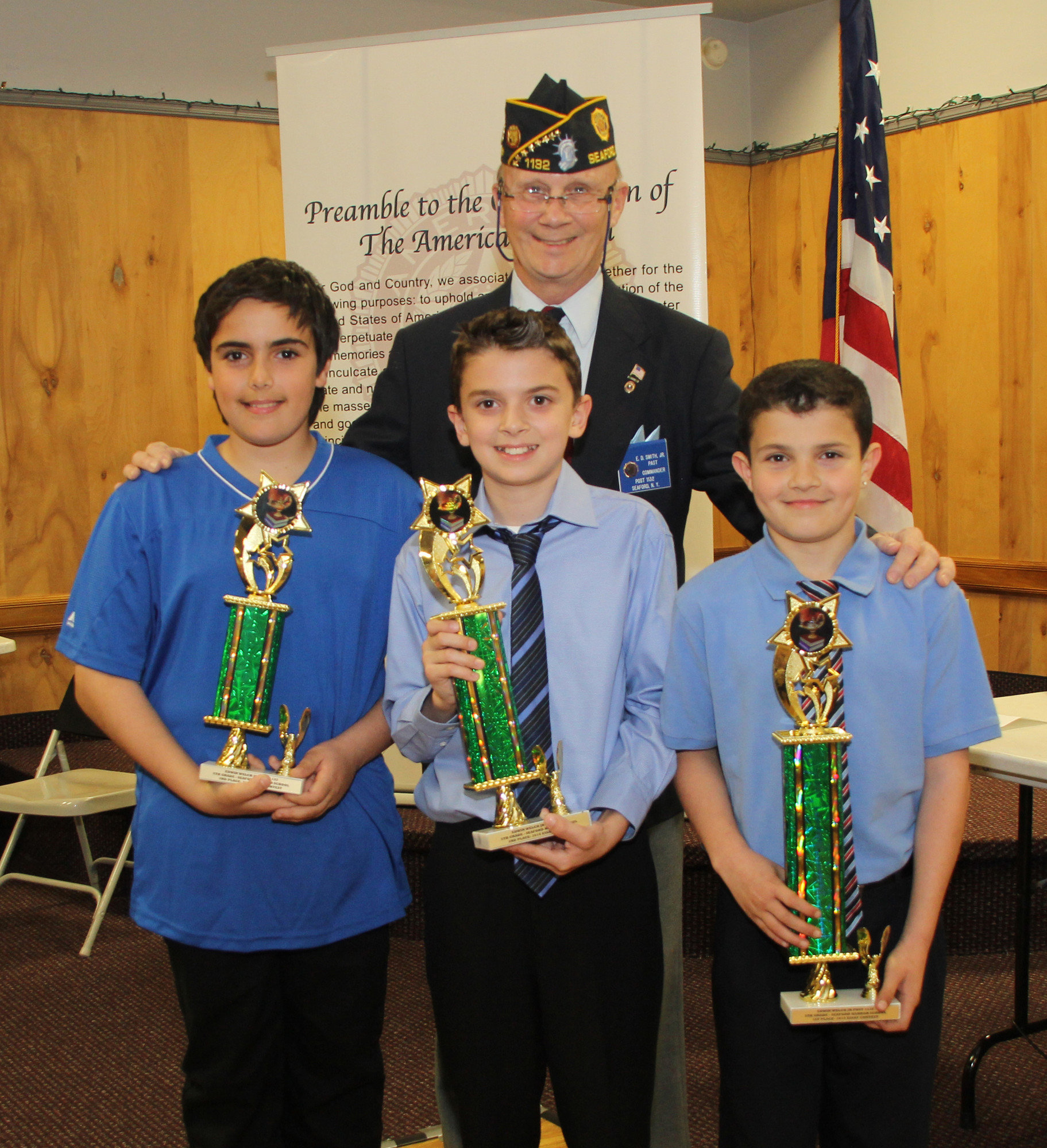 Legionnaire Ed Smith with the Seaford Harbor School fifth-grade winners of the Seaford American Legion Essay Contest 1st Place Hunter Tashjian, 2nd Place Joseph Saurman and 3rd Place Stephen Ierides