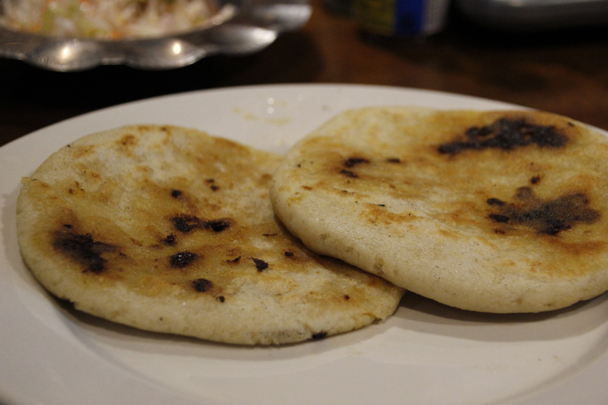 Pupusas, popular at La Perla, are thin handmade tortillas filled with combinations of pork, cheese, rice or beans.
