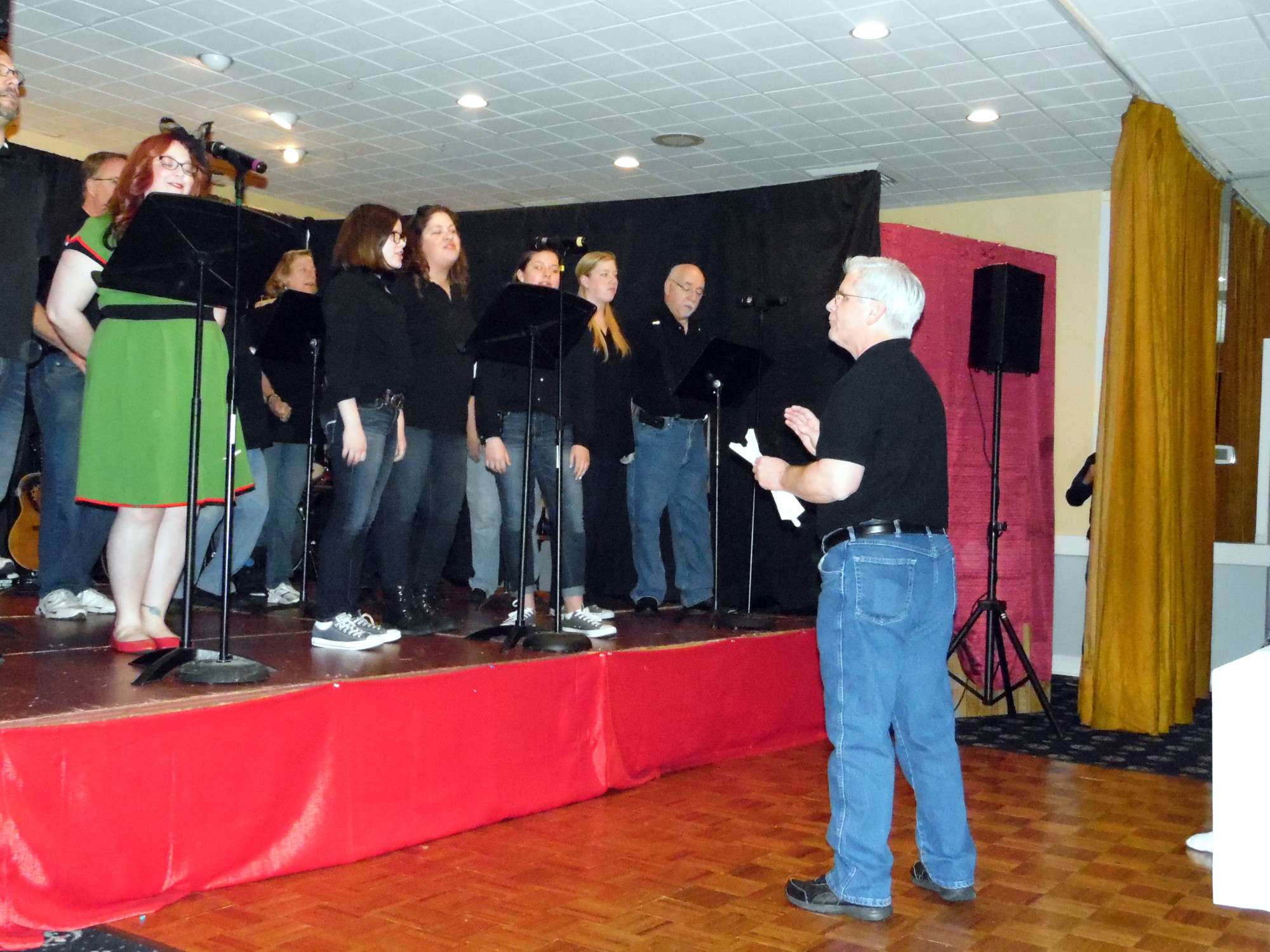 Choral Director Don Kolman led the singers in some lively tunes.