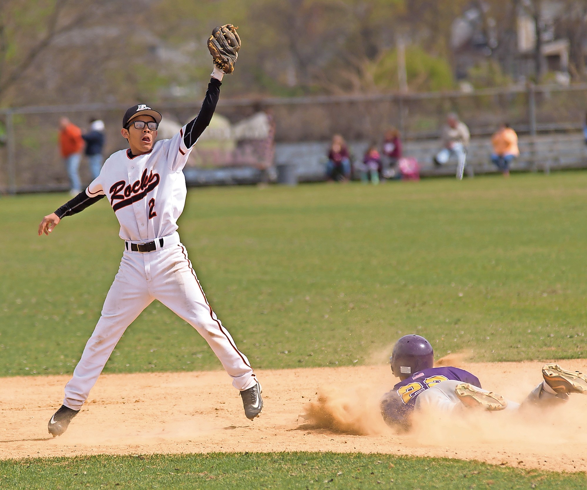 East Rockaway's Luis Umana, left, tried to erase an Oyster Bay runner at second base.