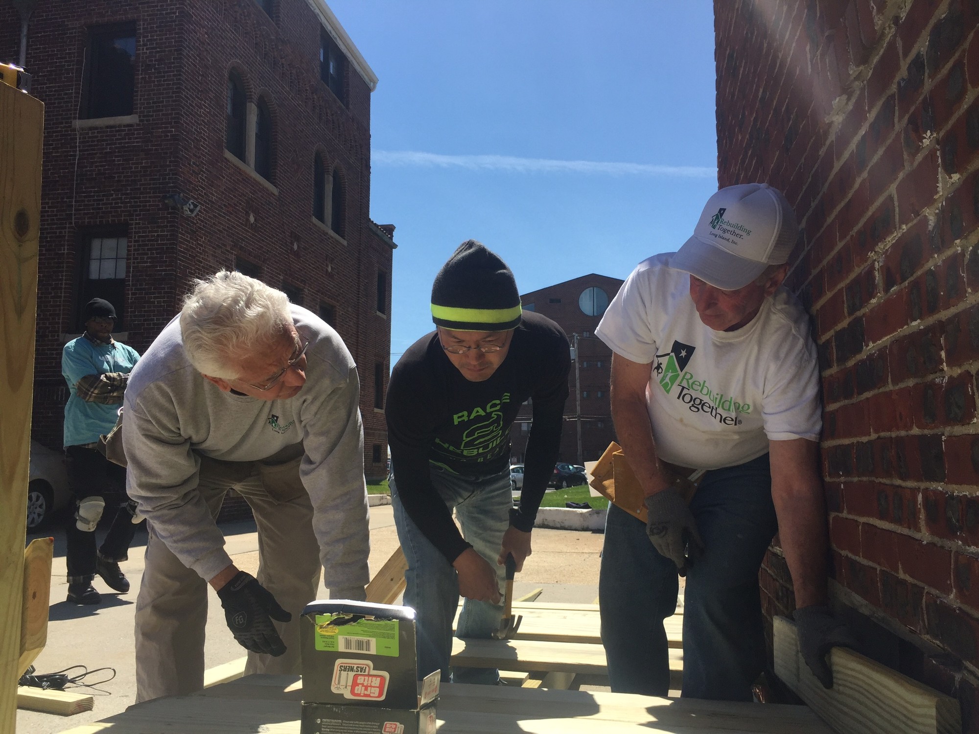 Volunteers worked on the installation of a wheelchair ramp at St. Ignatius Martyr Church as one of five projects last Saturday.