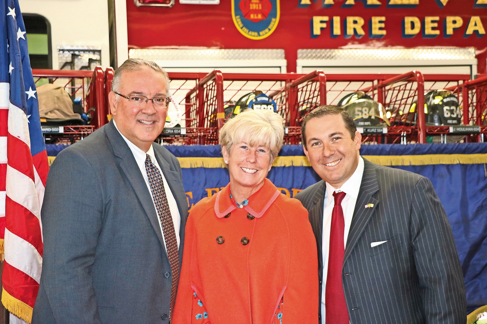 Mayor Patricia McDonald with Malverne residents Tom Grech, left, and Vincent LaVien at the Malverne firehouse last week.