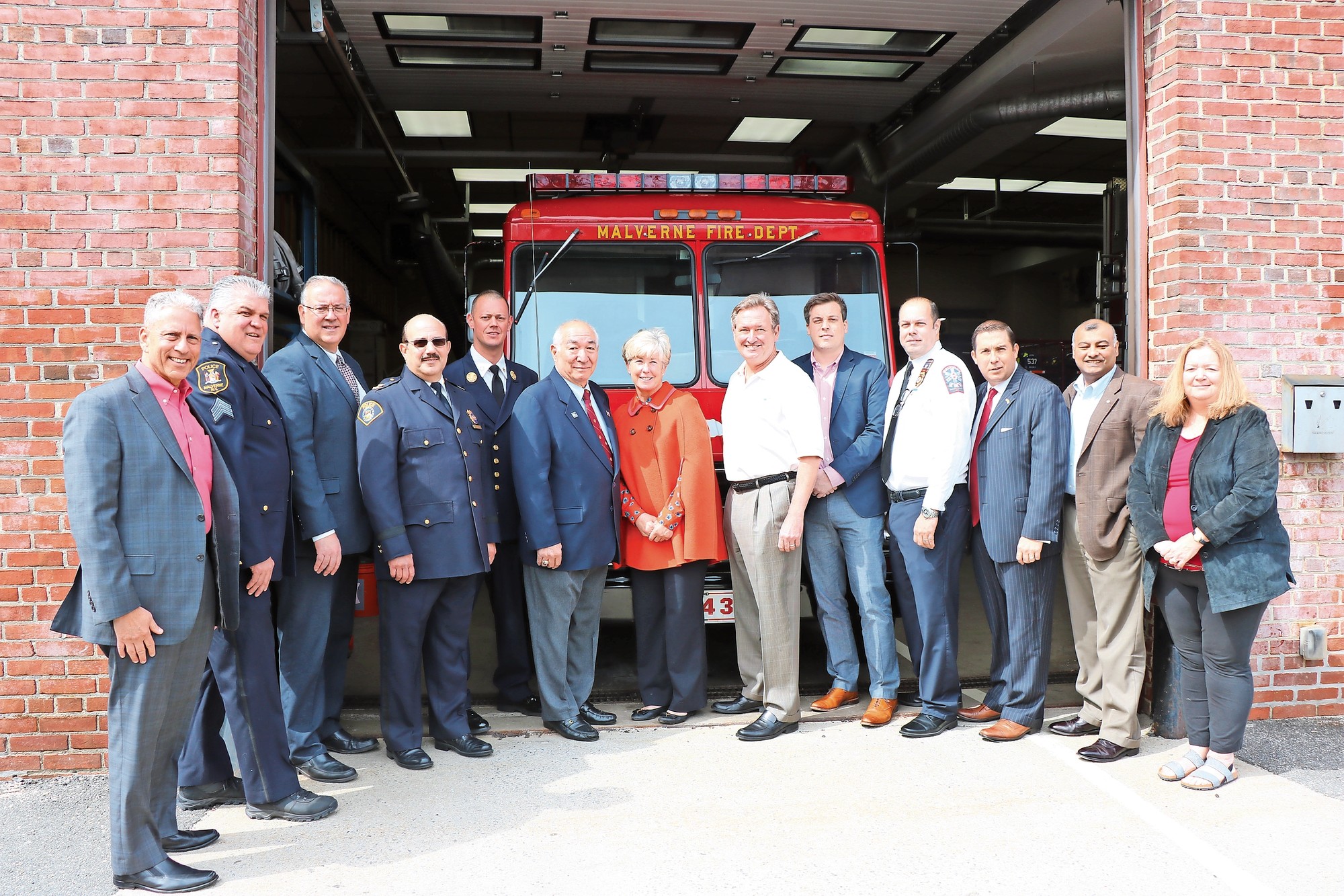 Some of Malverne's emergency response workers with Mayor McDonald, village residents and corporate officials at an event in late April at the Malverne Firehouse.
