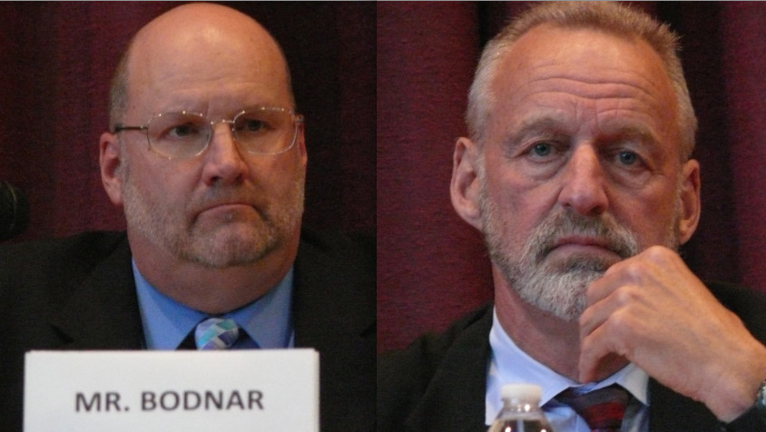 Perry Bodnar, left, a retiring teacher at Long Beach High School, and Board of Education President Roy Lester, seeking reelection, squared off at a candidates forum on Monday.