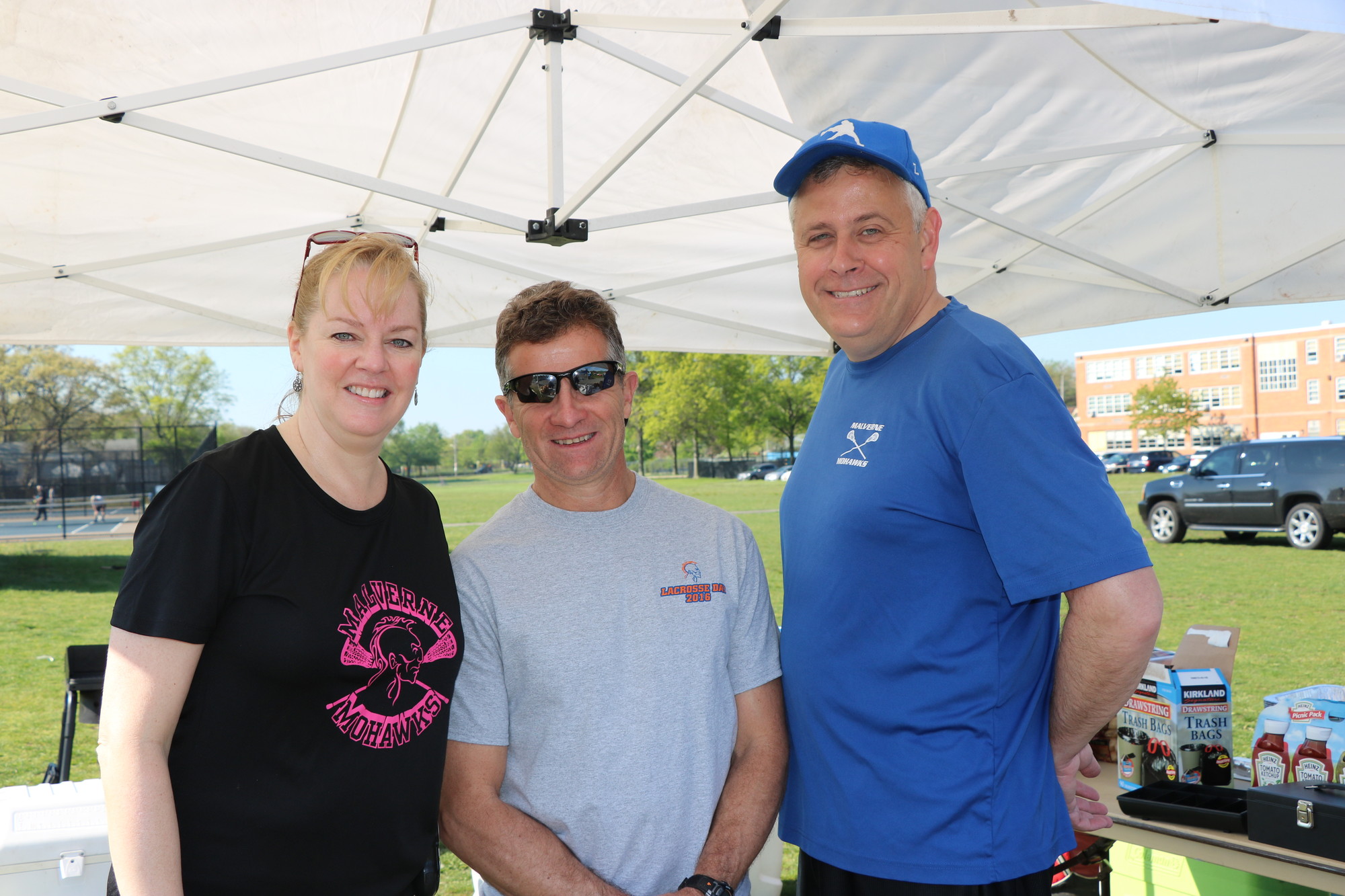 Bernadette Russell preps for Malverne Lacrosse Day last week. She was helped by Michael Ruddick and Frank Landers, both of whom have coached for the Malverne program.